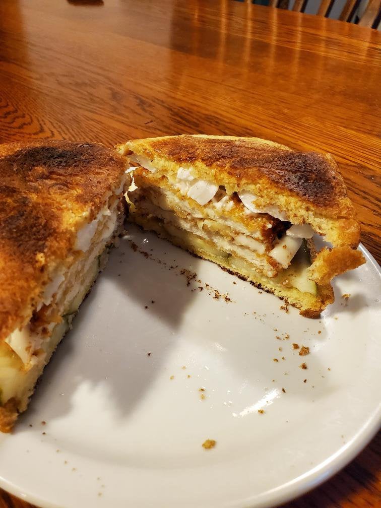Breaded chicken patties with provolone melted between them with onion