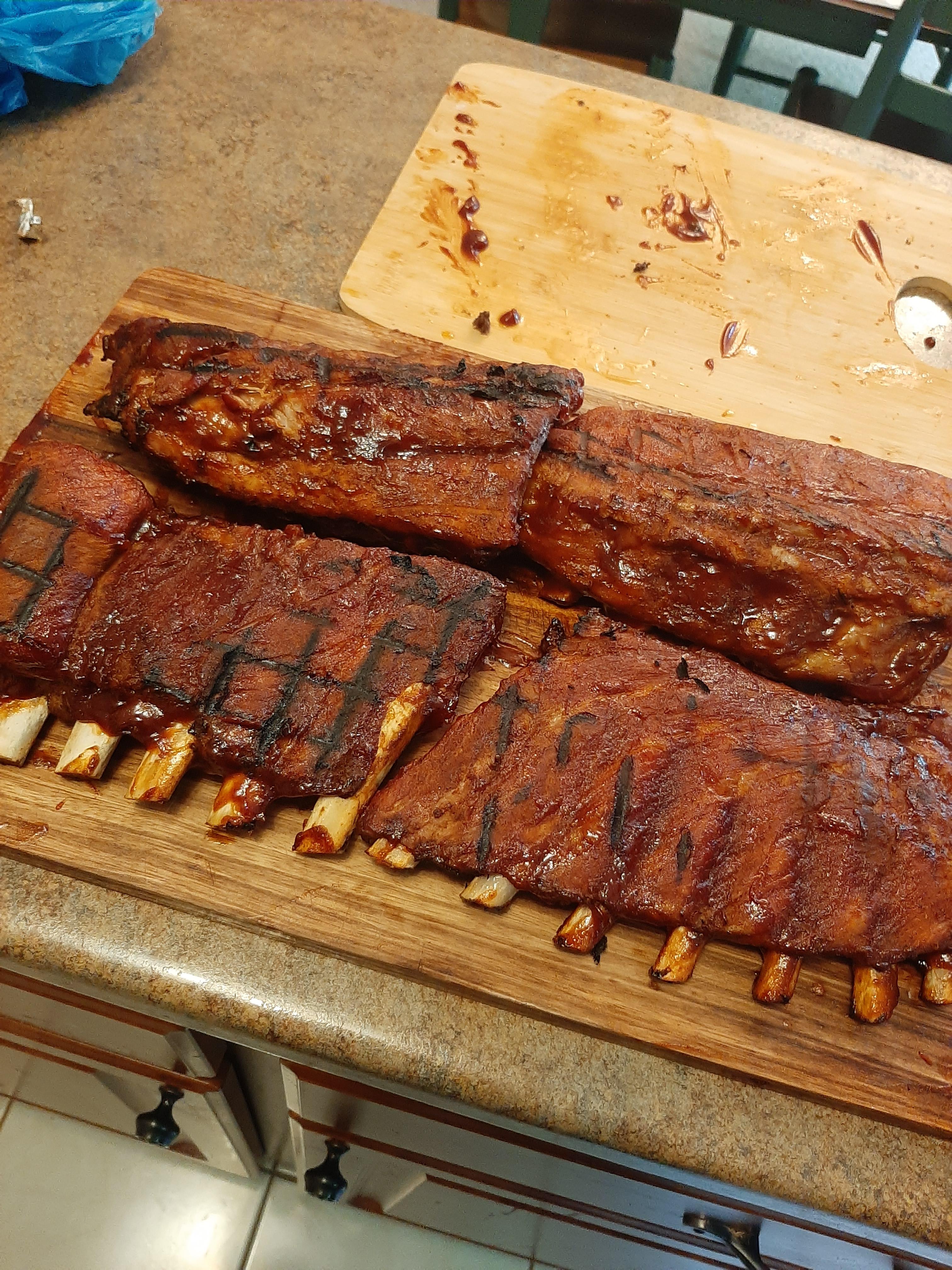 Double wrapped in foil on the propane grill for 80 mins. Turned out