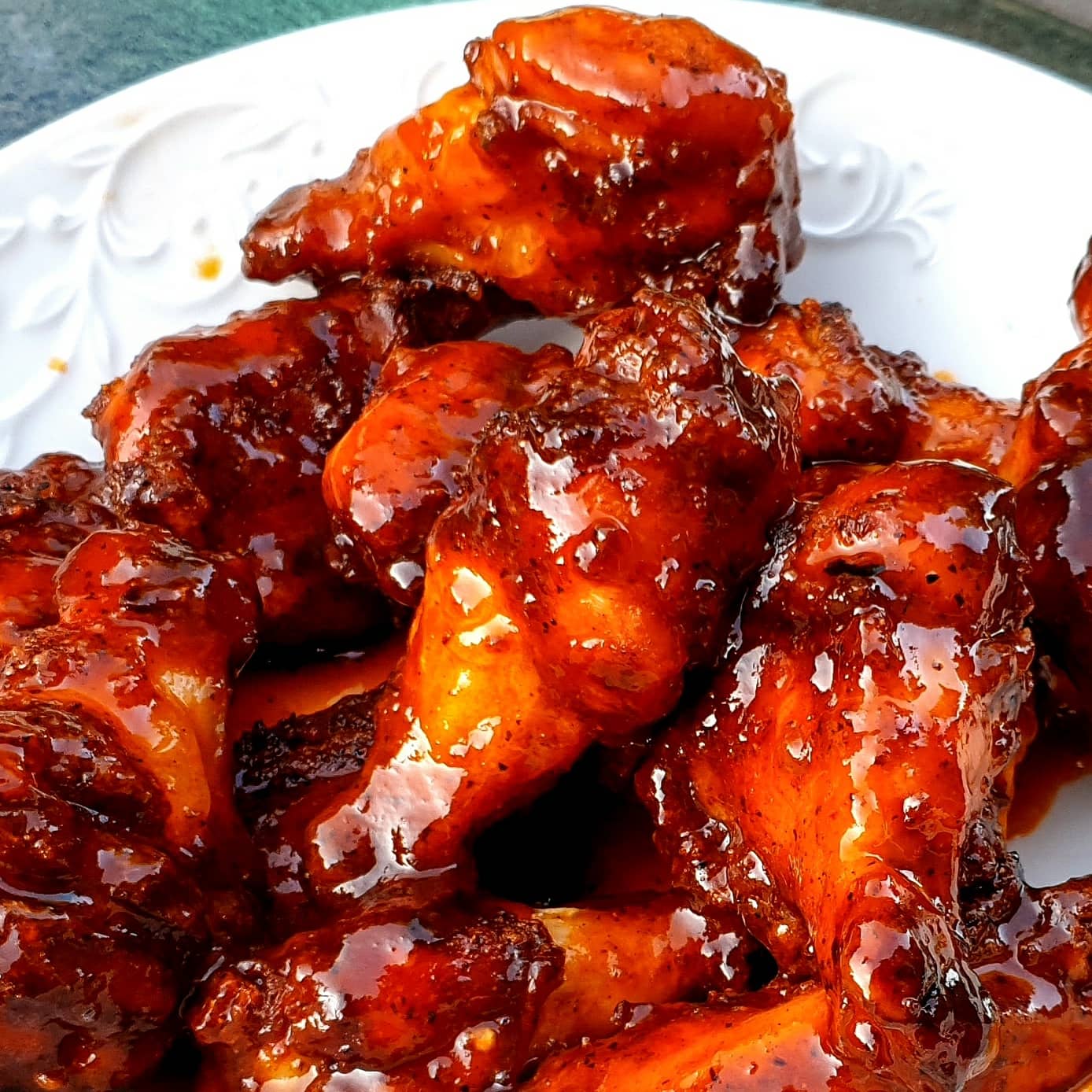 Juicy, saucy chicken wings. Make on the er Kettle with the vortex