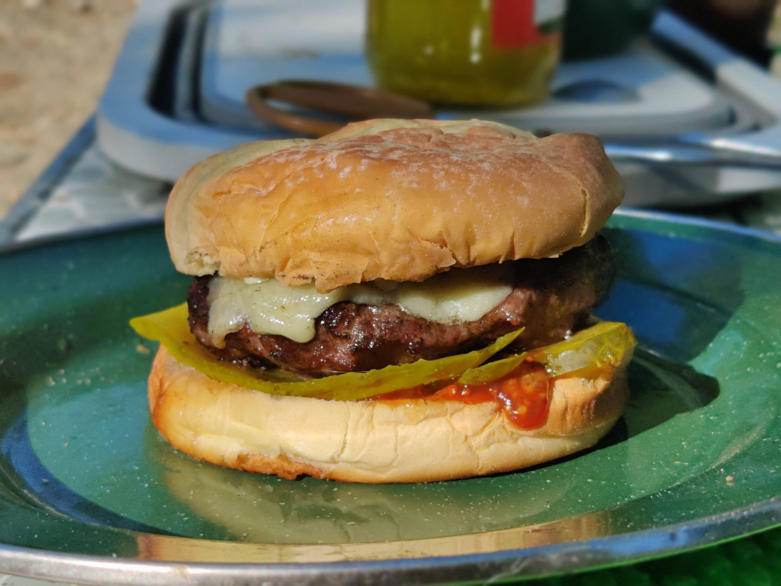 Campfire burger (50/50 patty of beef and pork, white cheddar, garlic dill pickles) Dining and
