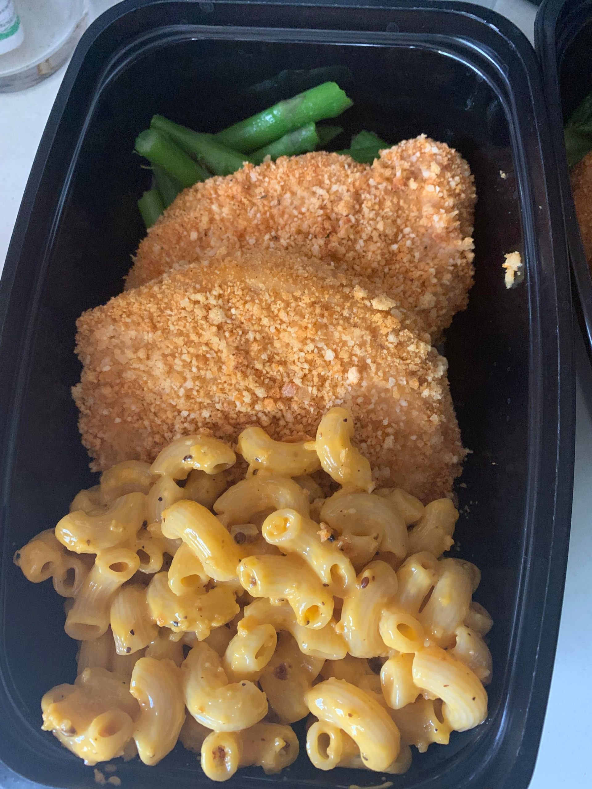 Oven baked breaded pork chops, mac & cheese, and frozen asparagus for