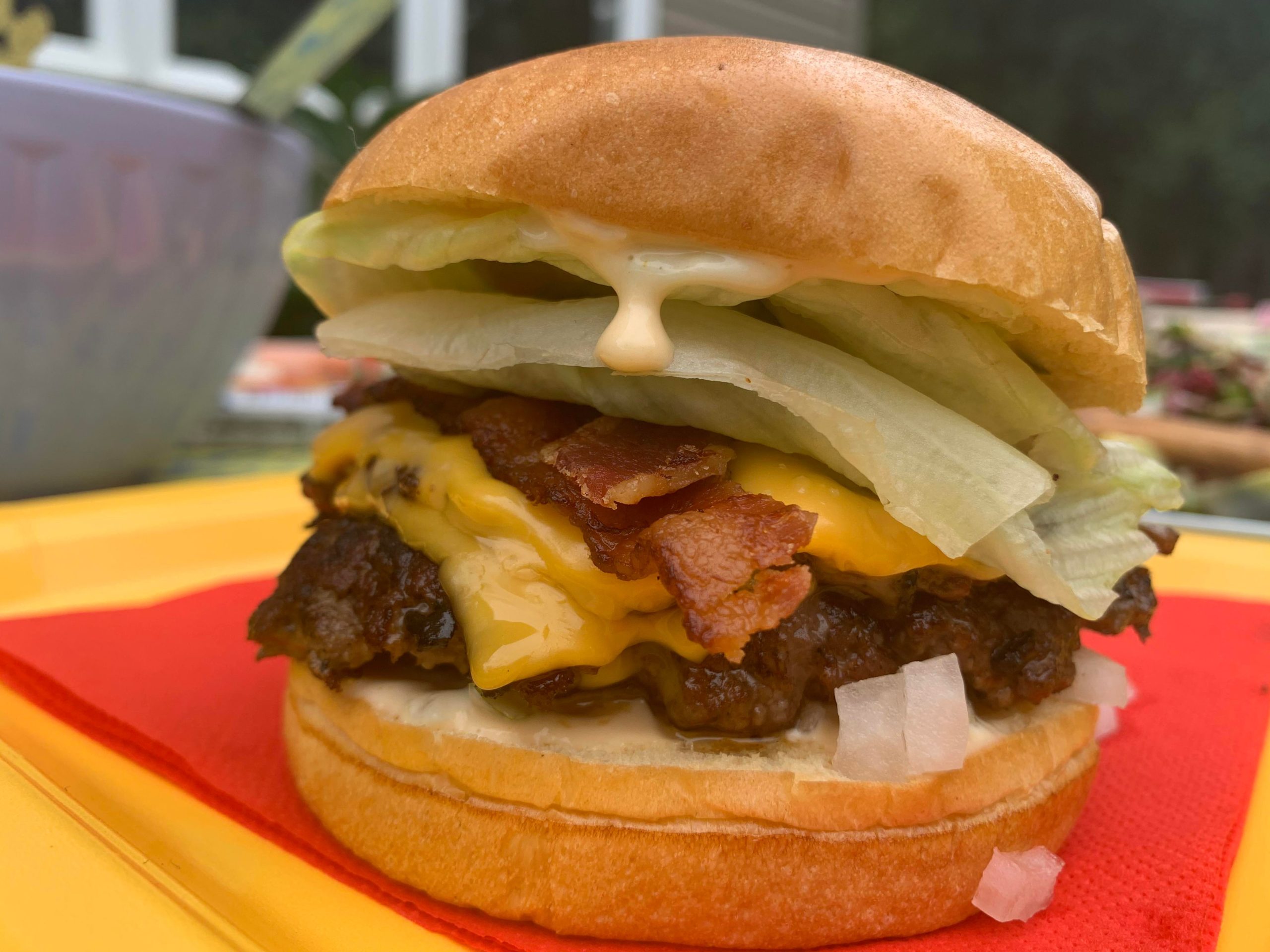 Double Smash burger with bacon , lettuce , onion , pickle, and Mac