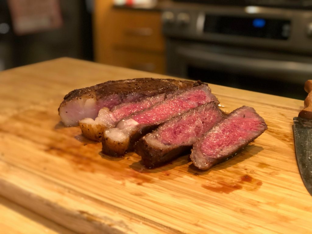 1.5 inch thick Australian MBS8+ wagyu ribeye cooked medium rare at 129F for 1.5 hours. Finished on cast iron with fat reserved from the raw steak.