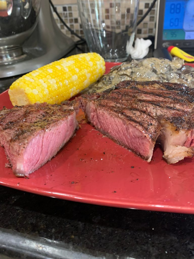 2 Inch Ribeye with German fried potatoes and corn on the cob (reverse