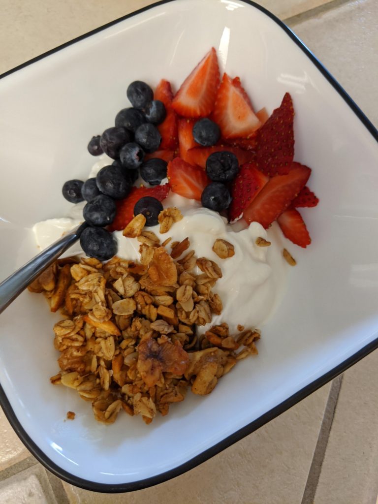 Home made granola, Two Good Greek yogurt and some fresh berries for less than 200 calories.