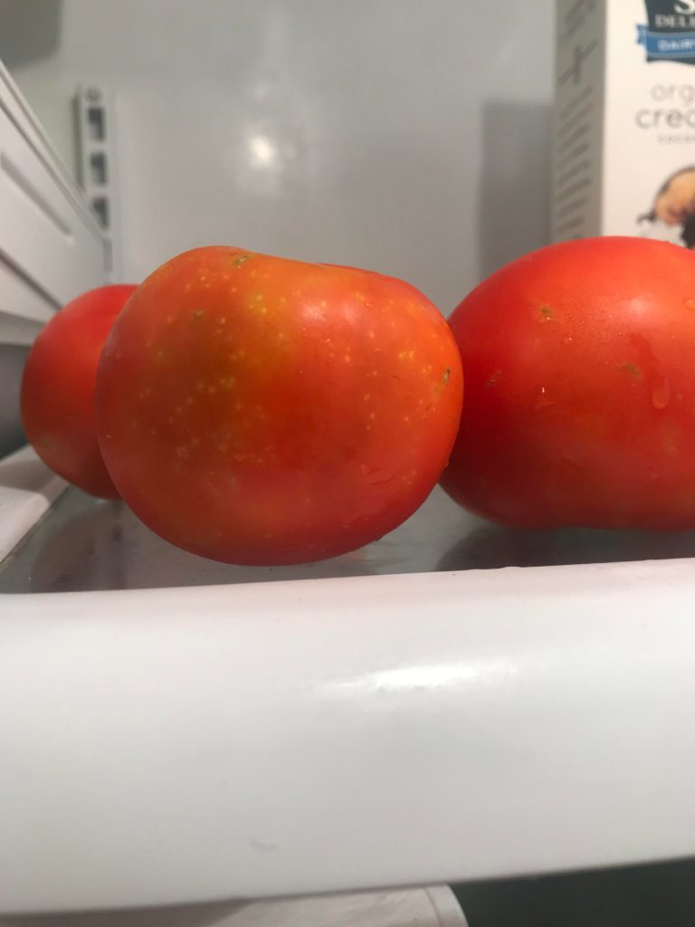 Yellow spots on tomatoes? Only some turned out like this. What could have caused it and are they okay to eat?