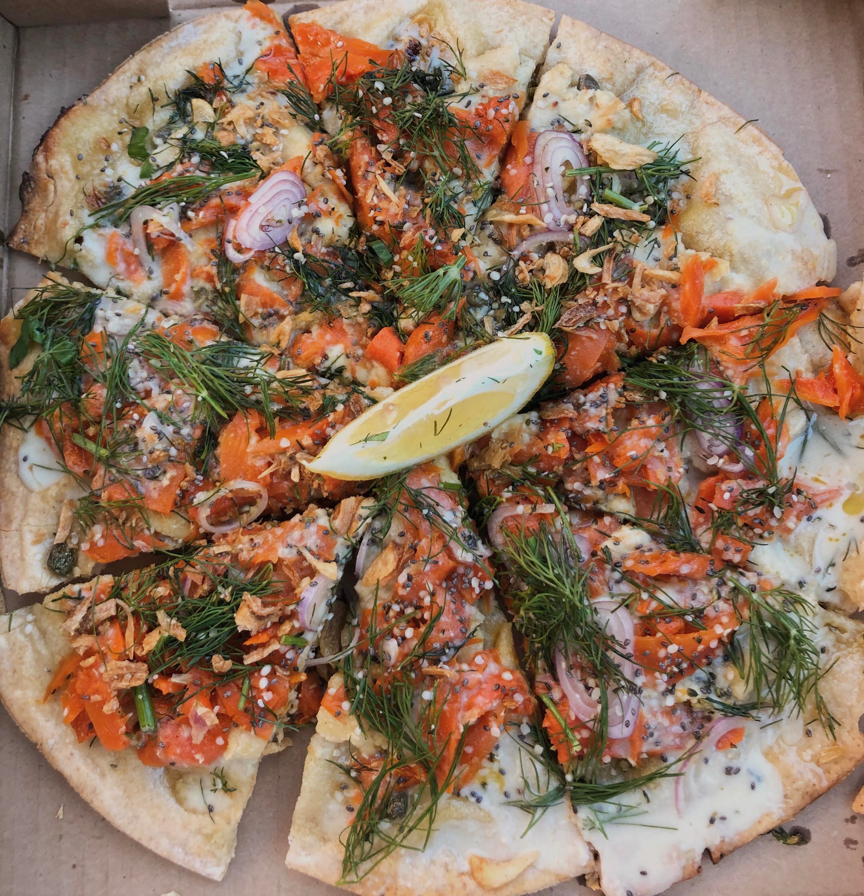 Vegan carrot lox pizza with horseradish crema, capers, shallots, cashew