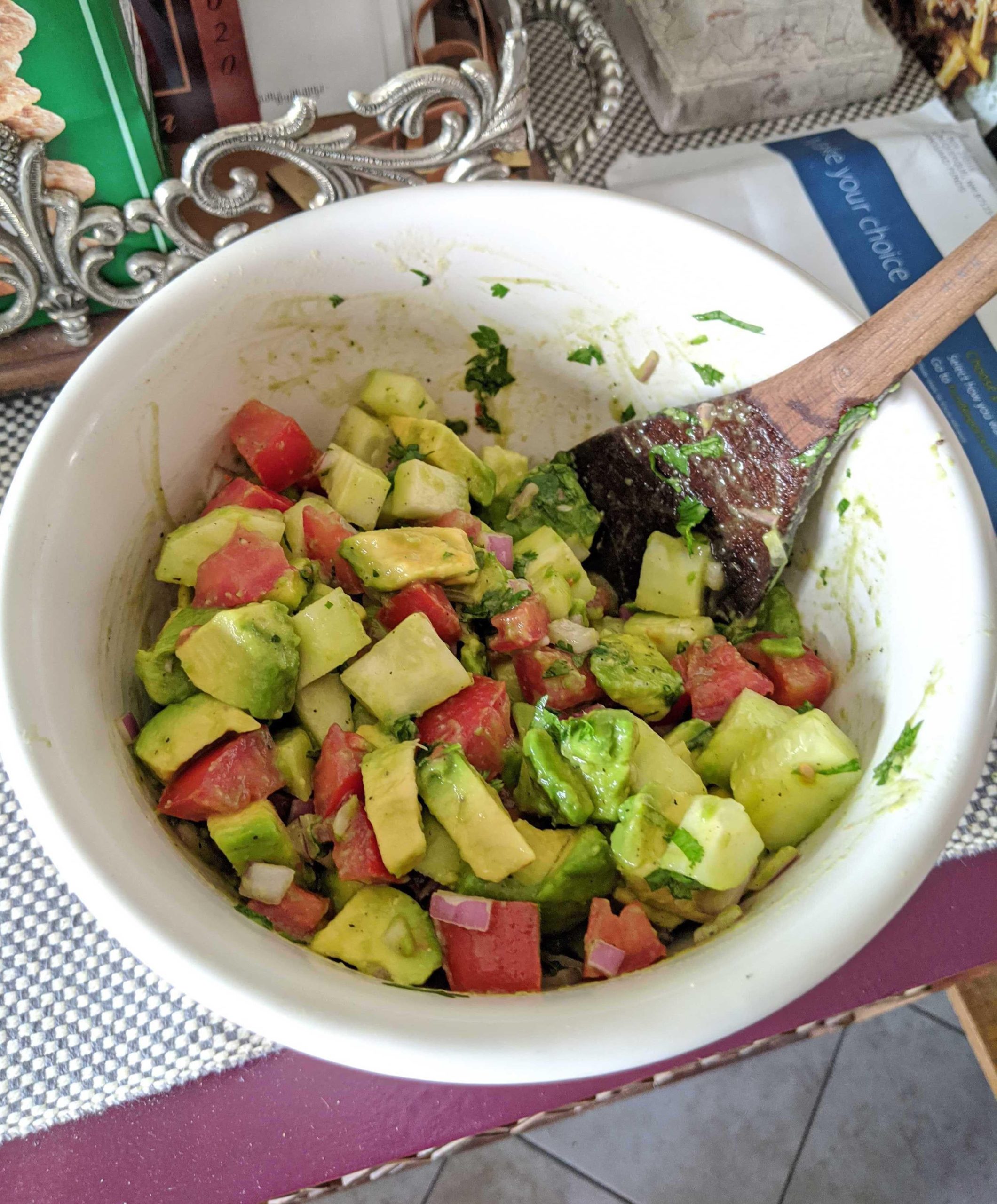 Salad tonight. Tomato cucumber avocado onion. On top cilantro lemon