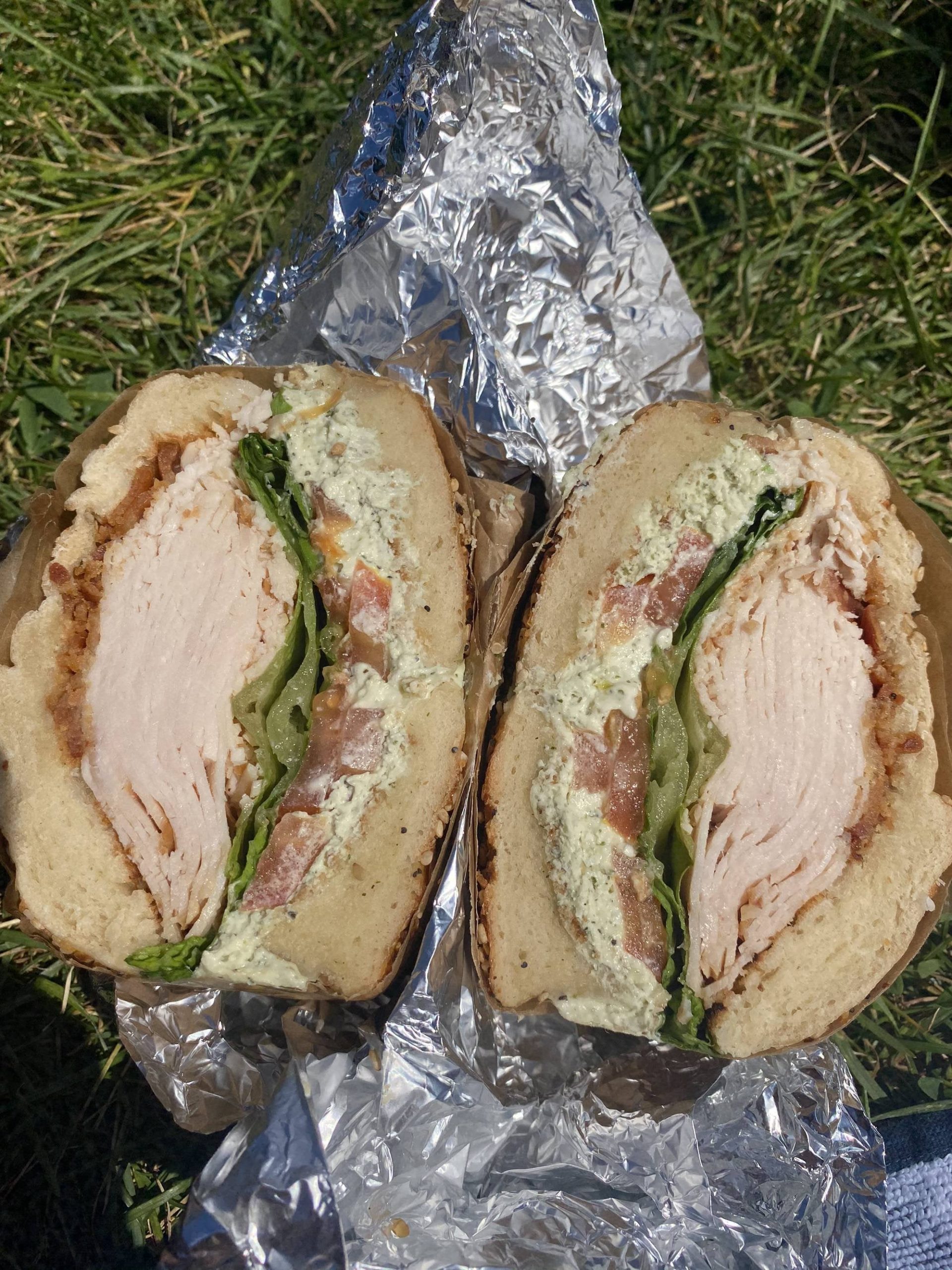 Turkey, bacon, lettuce, tomato, garlic and herb cream cheese on a