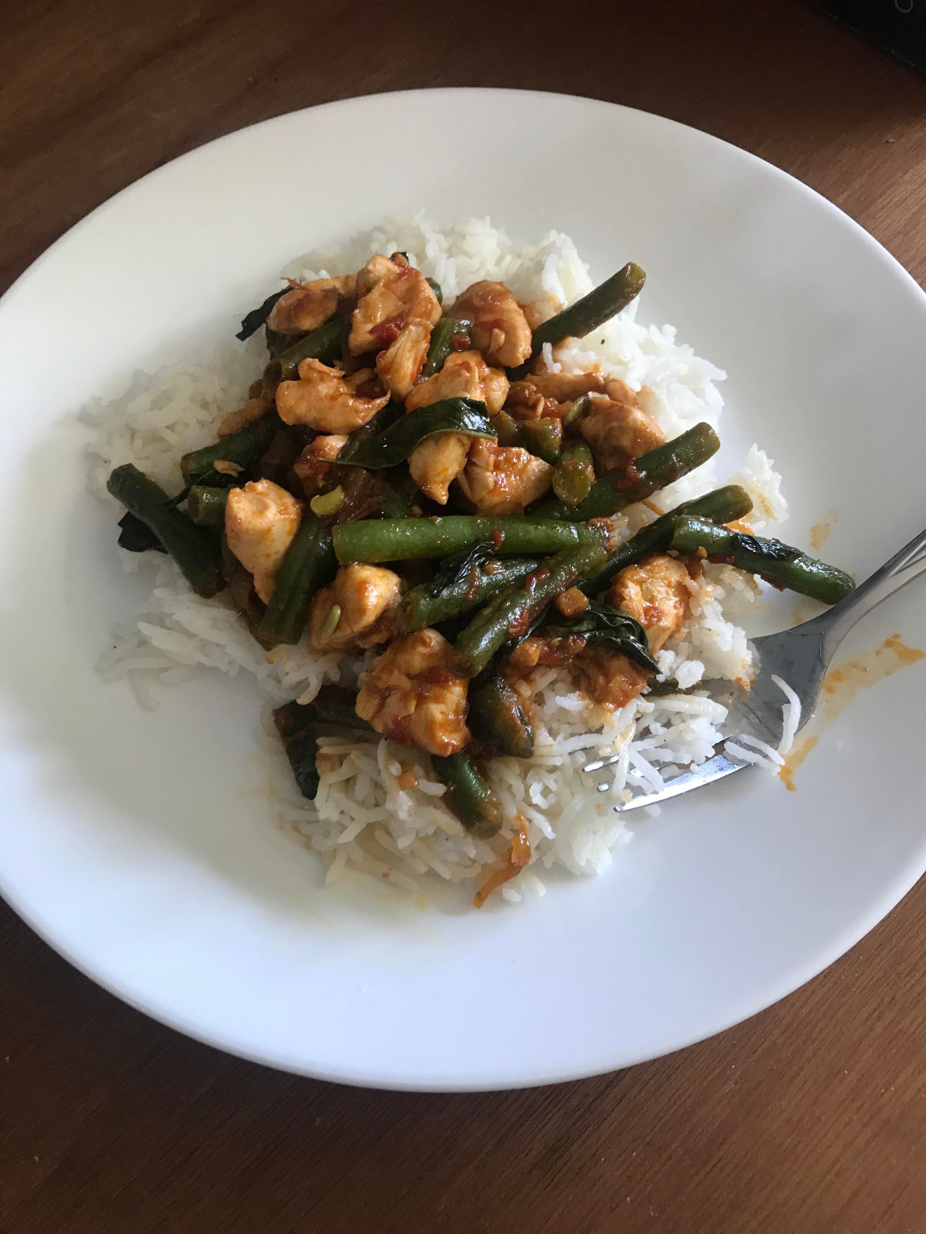 Spicy basil chicken with fresh green beans with a harrisa, soy sauce, and honey glaze. Dining