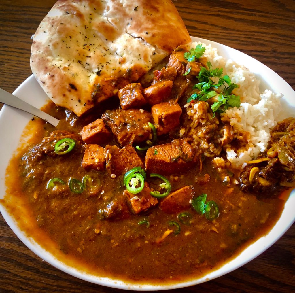 Chicken/Paneer curry w/ rice, pickles and naan.