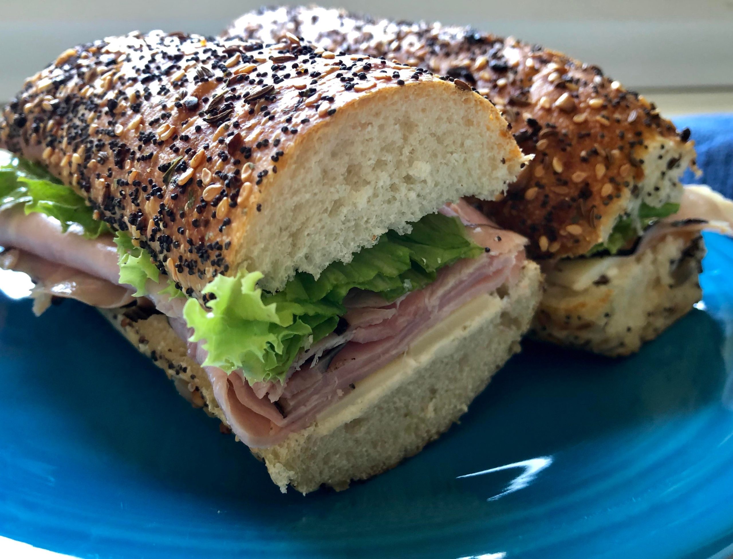 French Ham Baguette Sandwich. Butter, Gruyere, Ham, Lettuce, on a