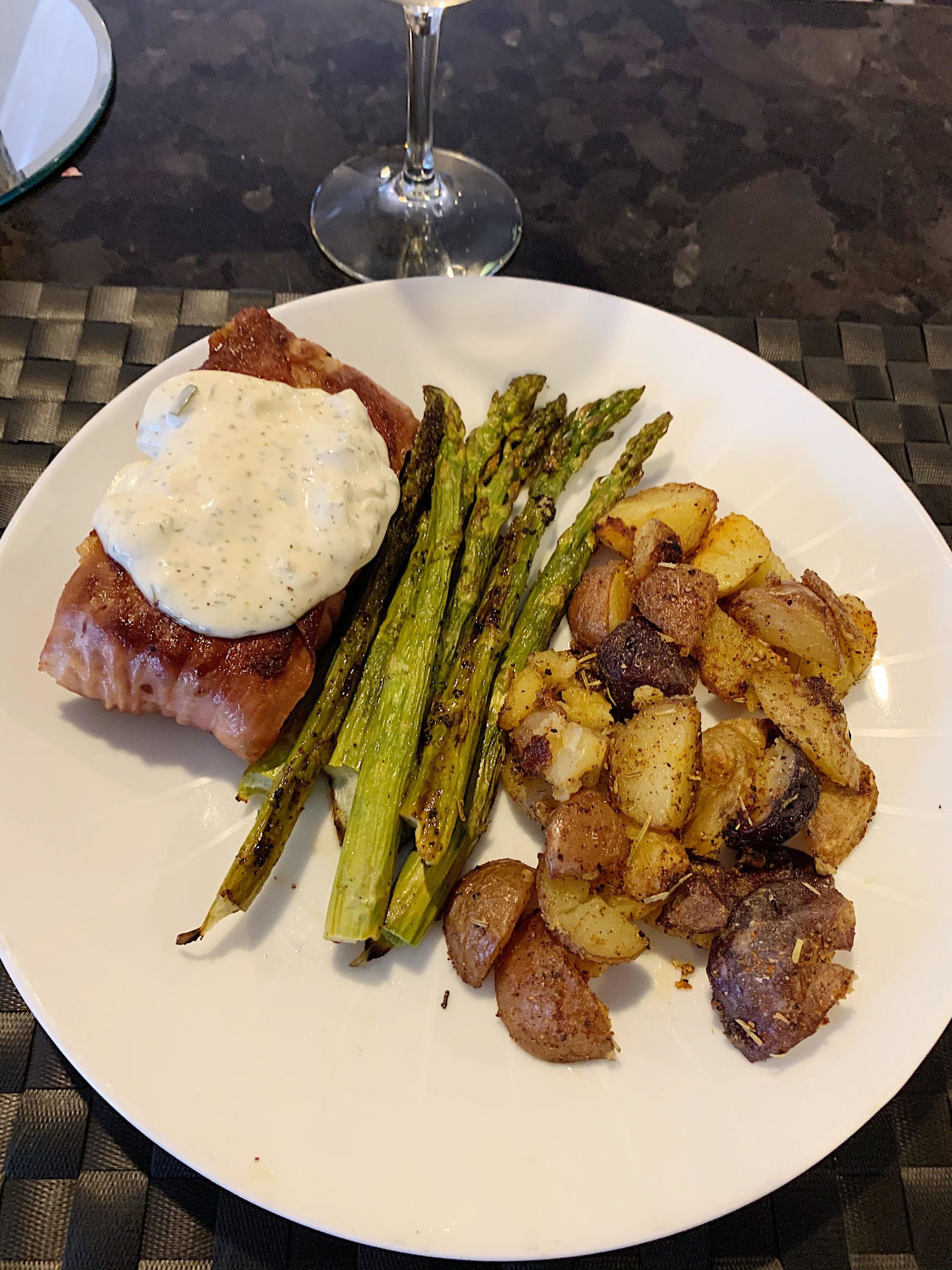 Prosciutto wrapped halibut with a side of lemon asparagus and crispy potatoes. Dining and Cooking