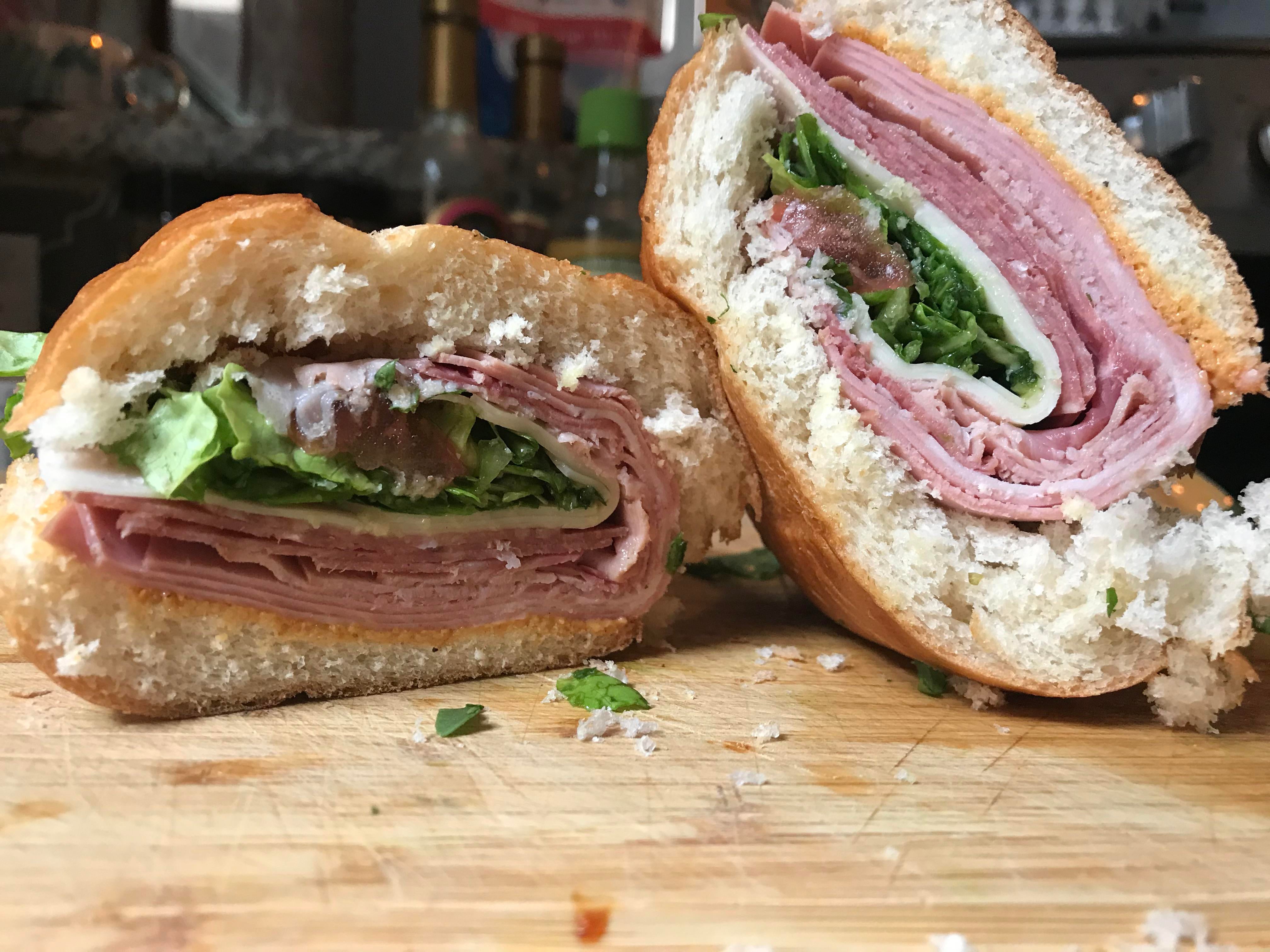 My Italian mortadella, salami, ham, and provolone; lettuce & tomato, S&P, oregano, oil