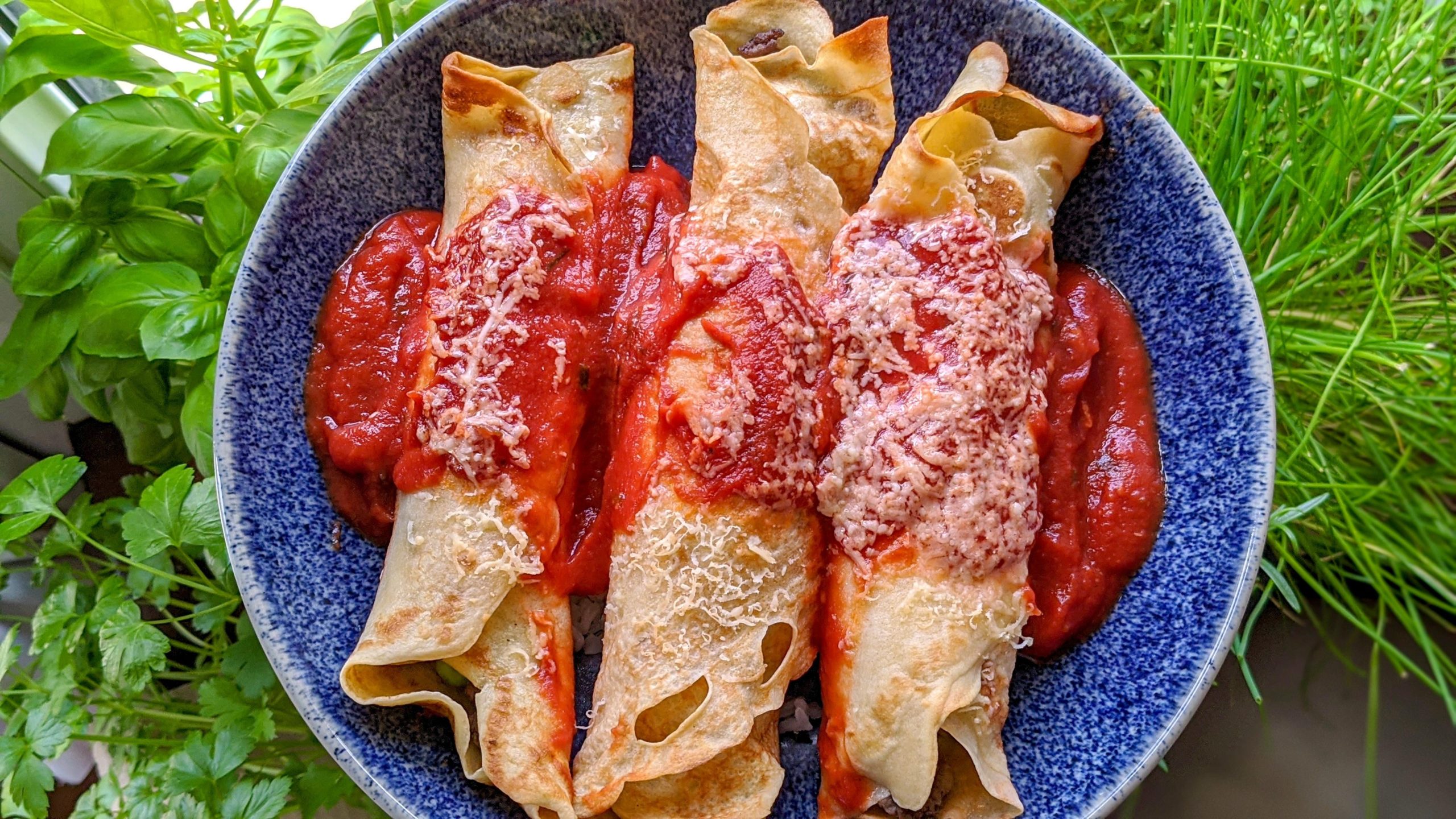 Brazilian style pancakes, filled with ground beef and mushrooms, topped