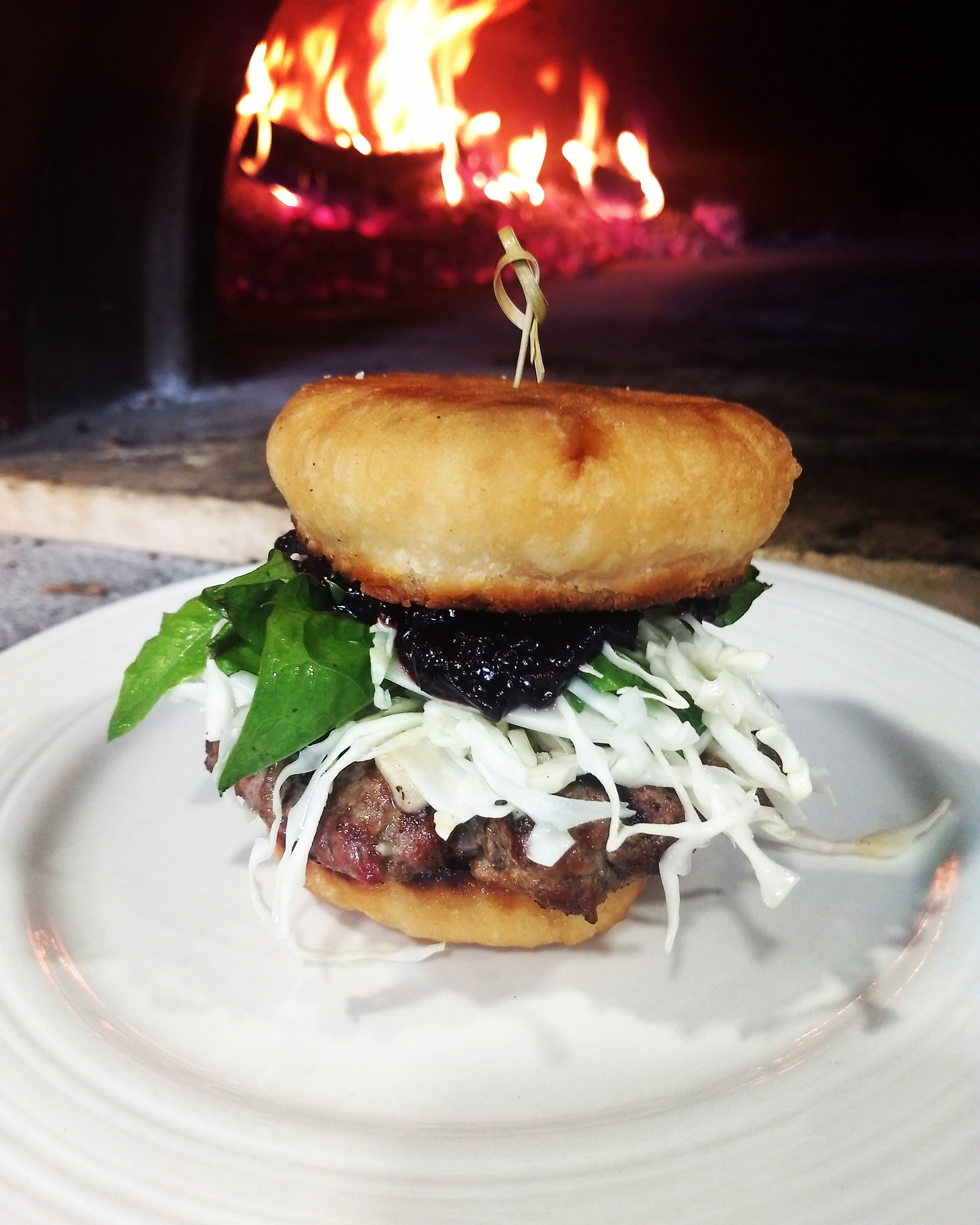 Bannock burger with smoked wild b.c. blueberry ketchup and dandelion