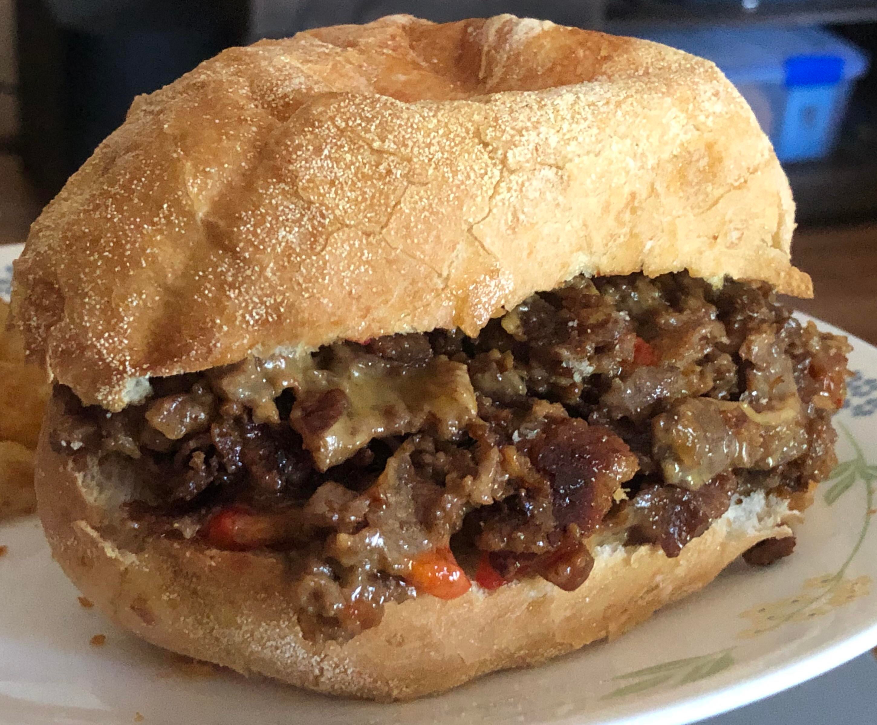 Philly Cheesesteak with Caramelized Onions & Roasted Red Peppers on a