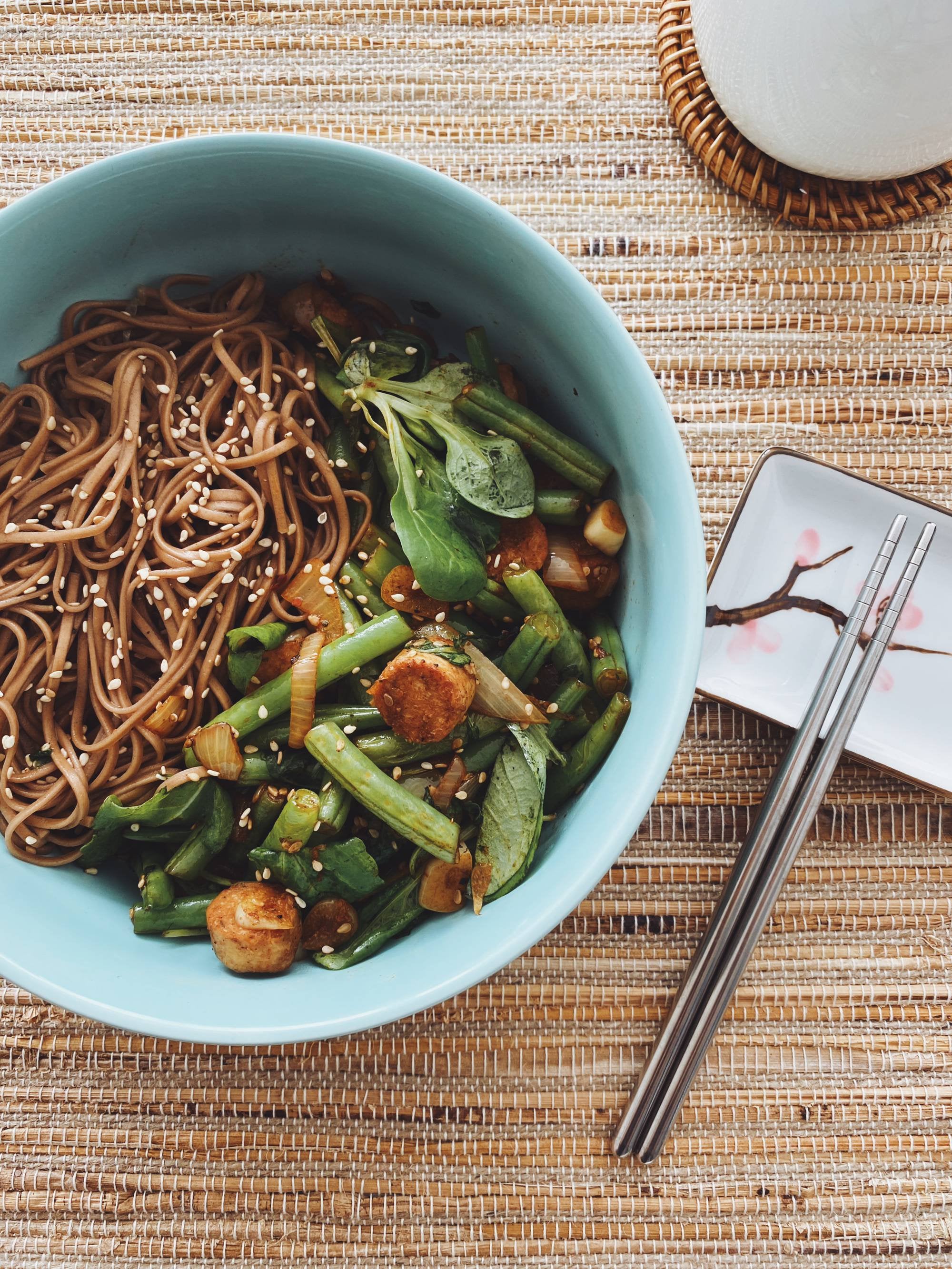 Sobs sesame noodles and green beans, arugula with vegan sausage stir