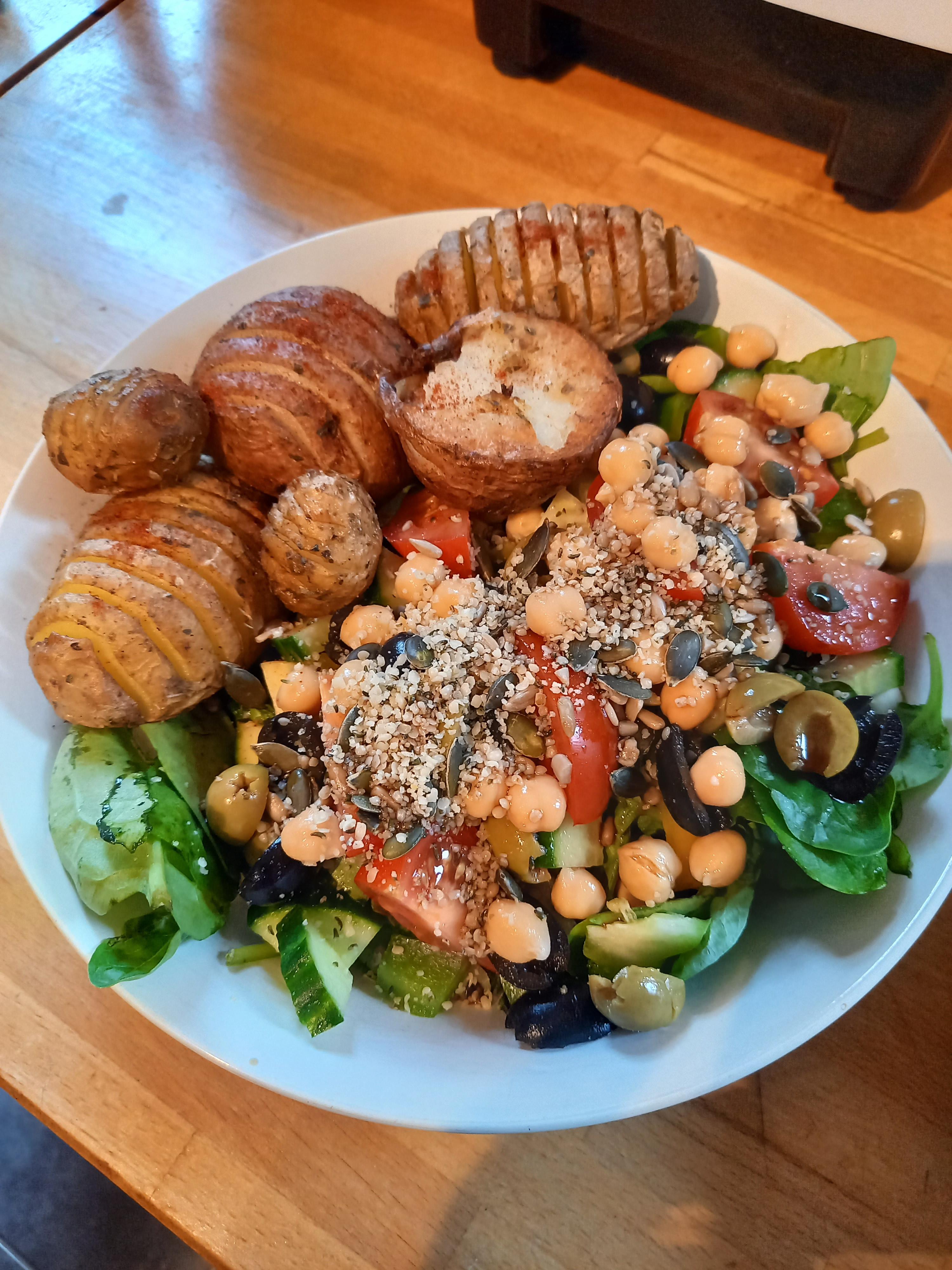Tonights dinner roast potatoes and salad, topped with mixed seeds and