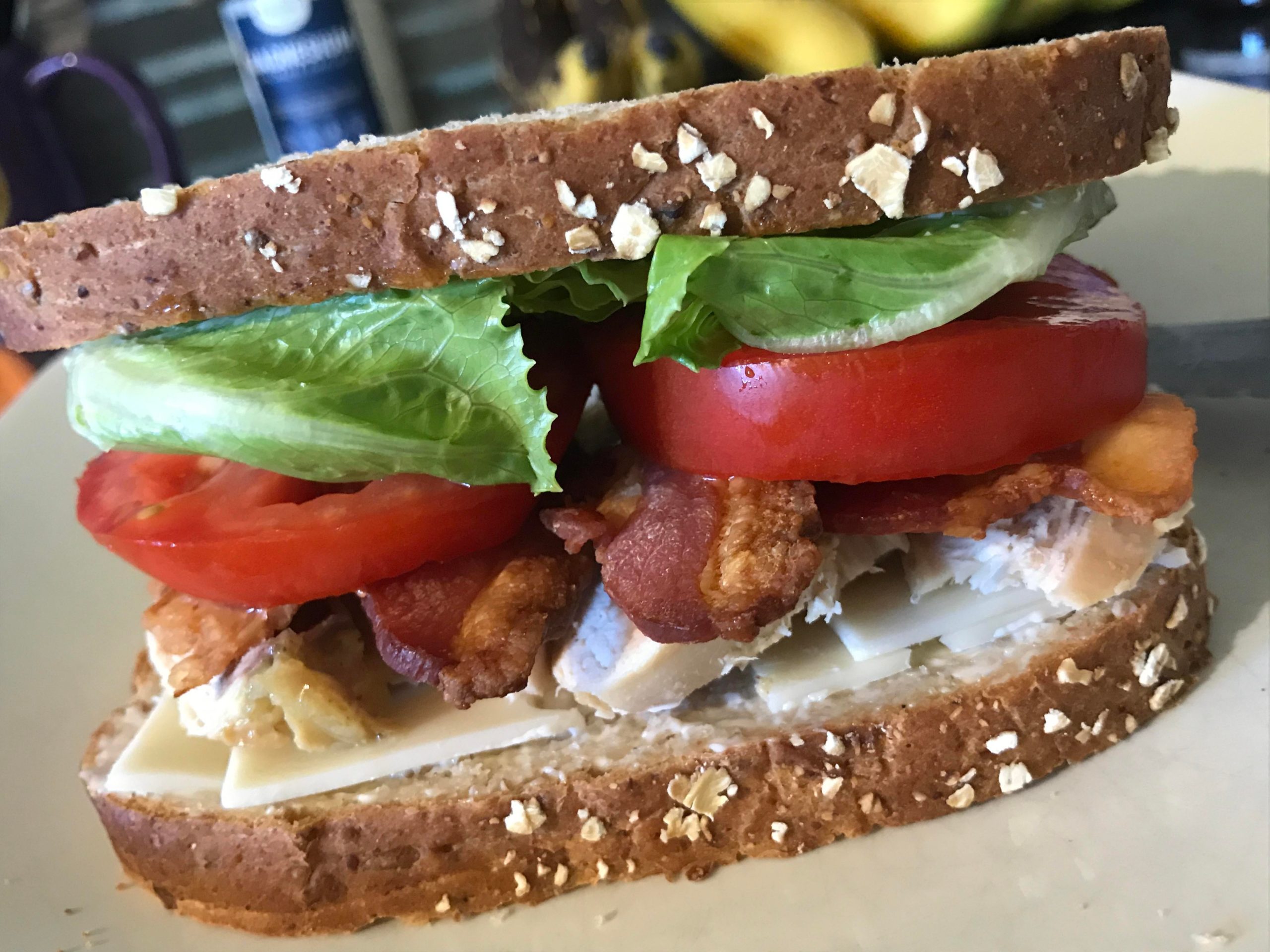Cold sliced chicken breast, bacon, Swiss, lettuce, tomato and mayo on 12 grain. Dining and Cooking