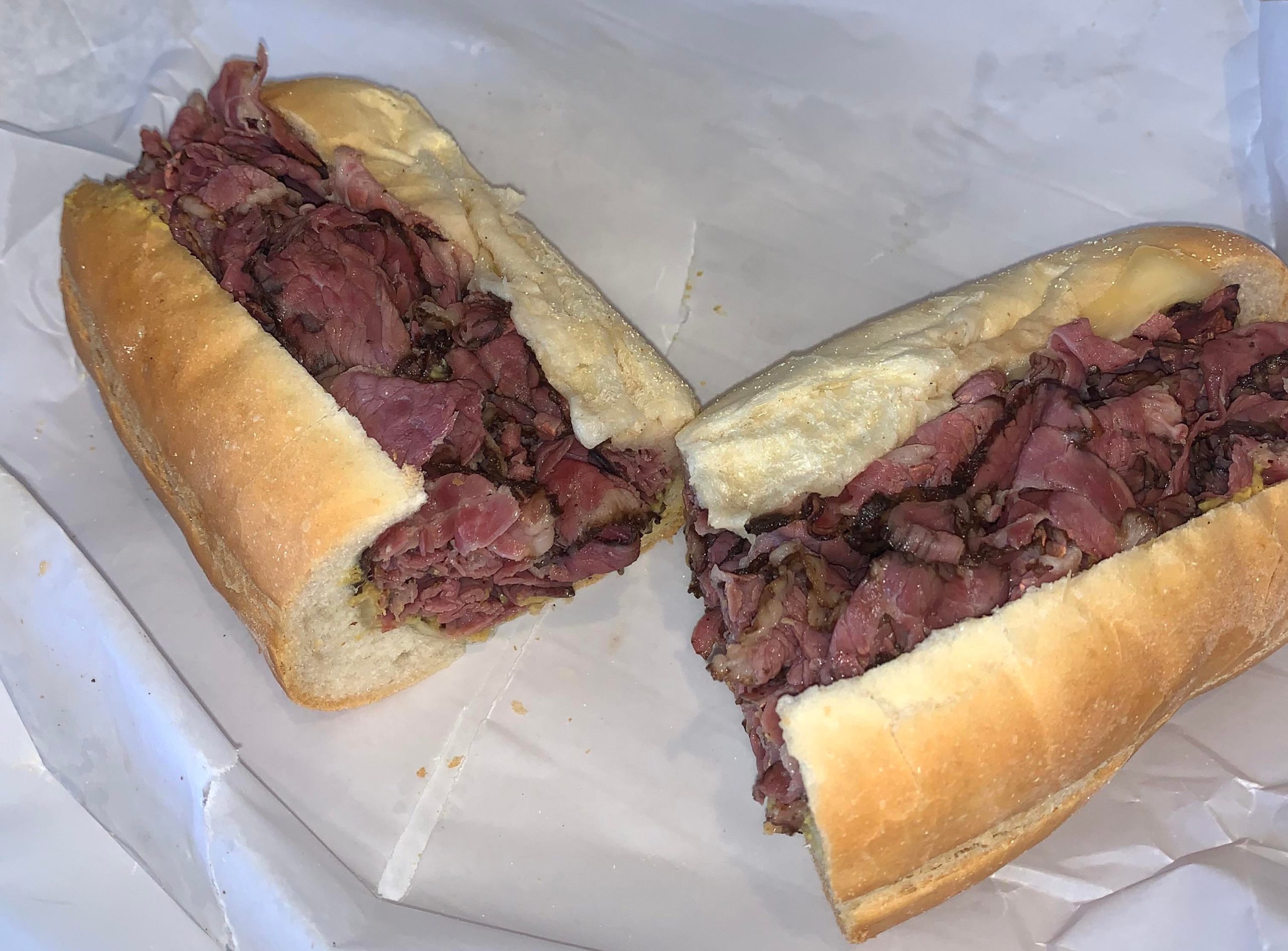 Pastrami sub with Swiss cheese and spicy mustard Dining and Cooking
