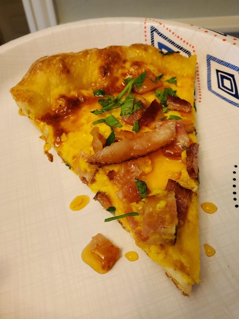 Bacon egg and cheese breakfast pizza with hot honey