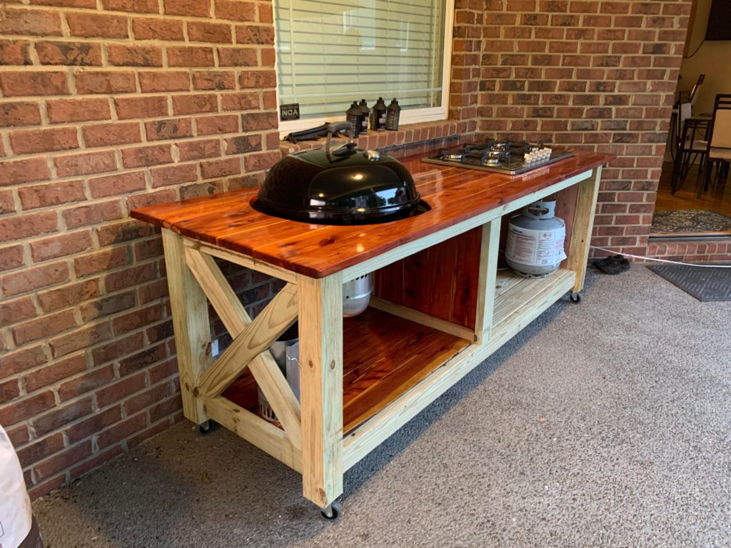 Just built a grilling table for my Weber kettle and added a built in stove for those messy cooks!