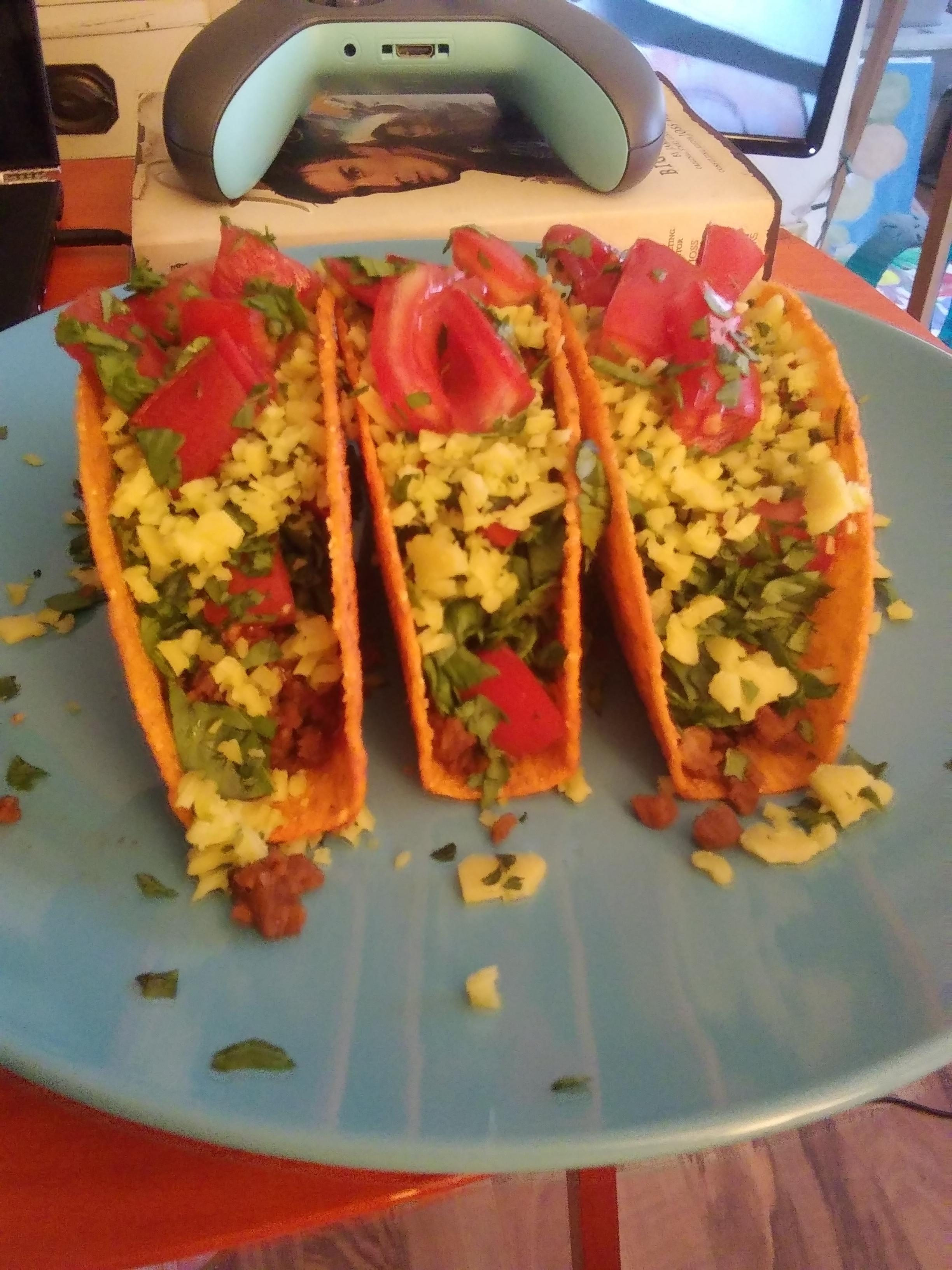 Homemade tacos! Plant based ground, lettuce, tomato, and Gouda cheese
