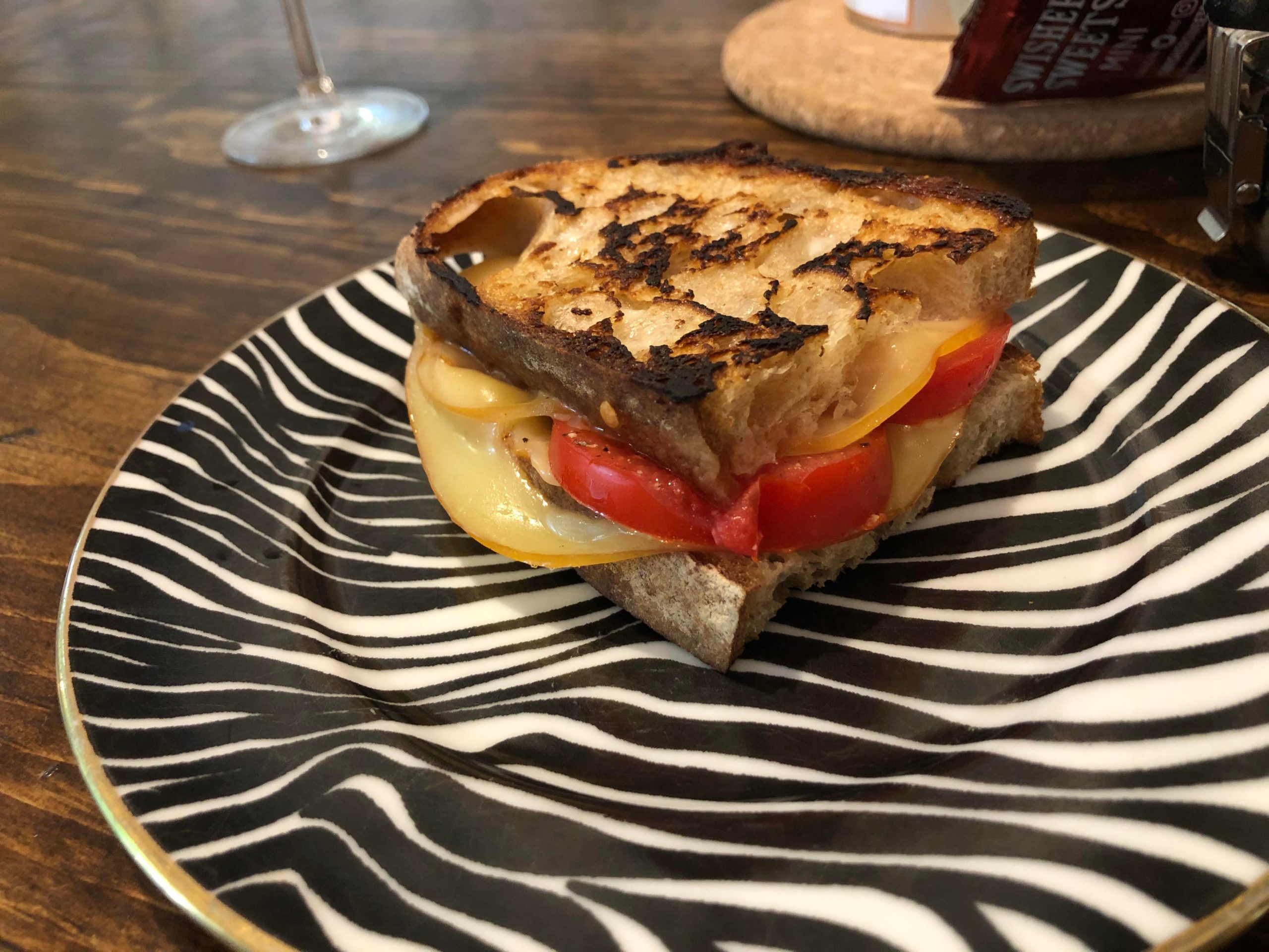 Local sourdough, garden tomato, salt, pepper, and smoked Gouda, fried