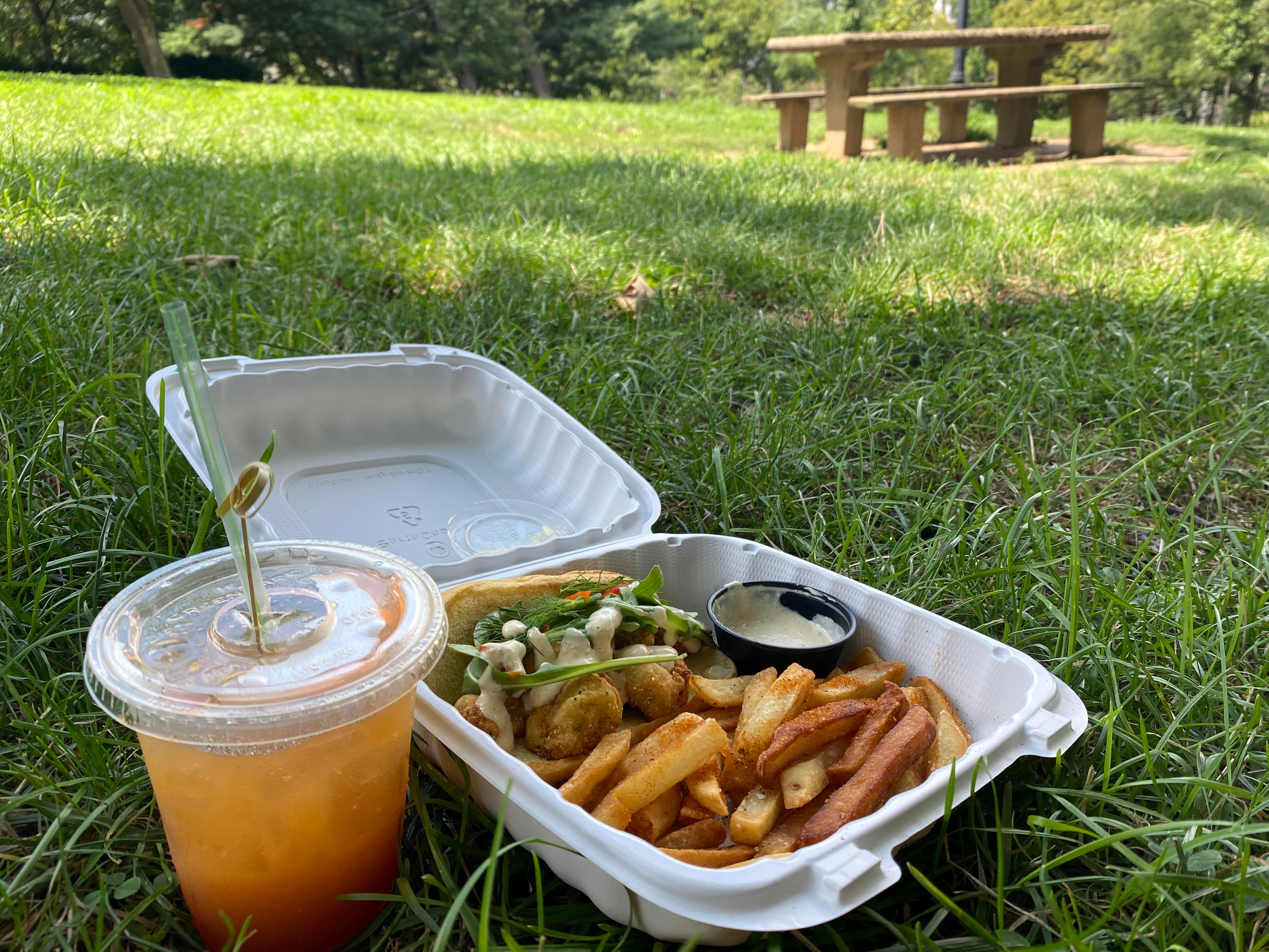 Fried Mussel sandwich with some nice seasoned fries in the park at AdMo