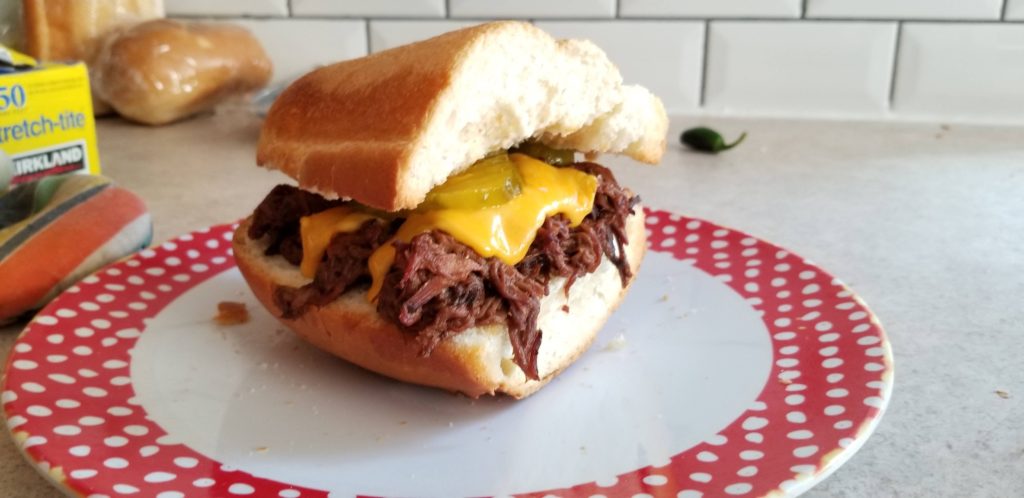 Beef roast, cheddar, bread and butter pickles on a toasty baguette