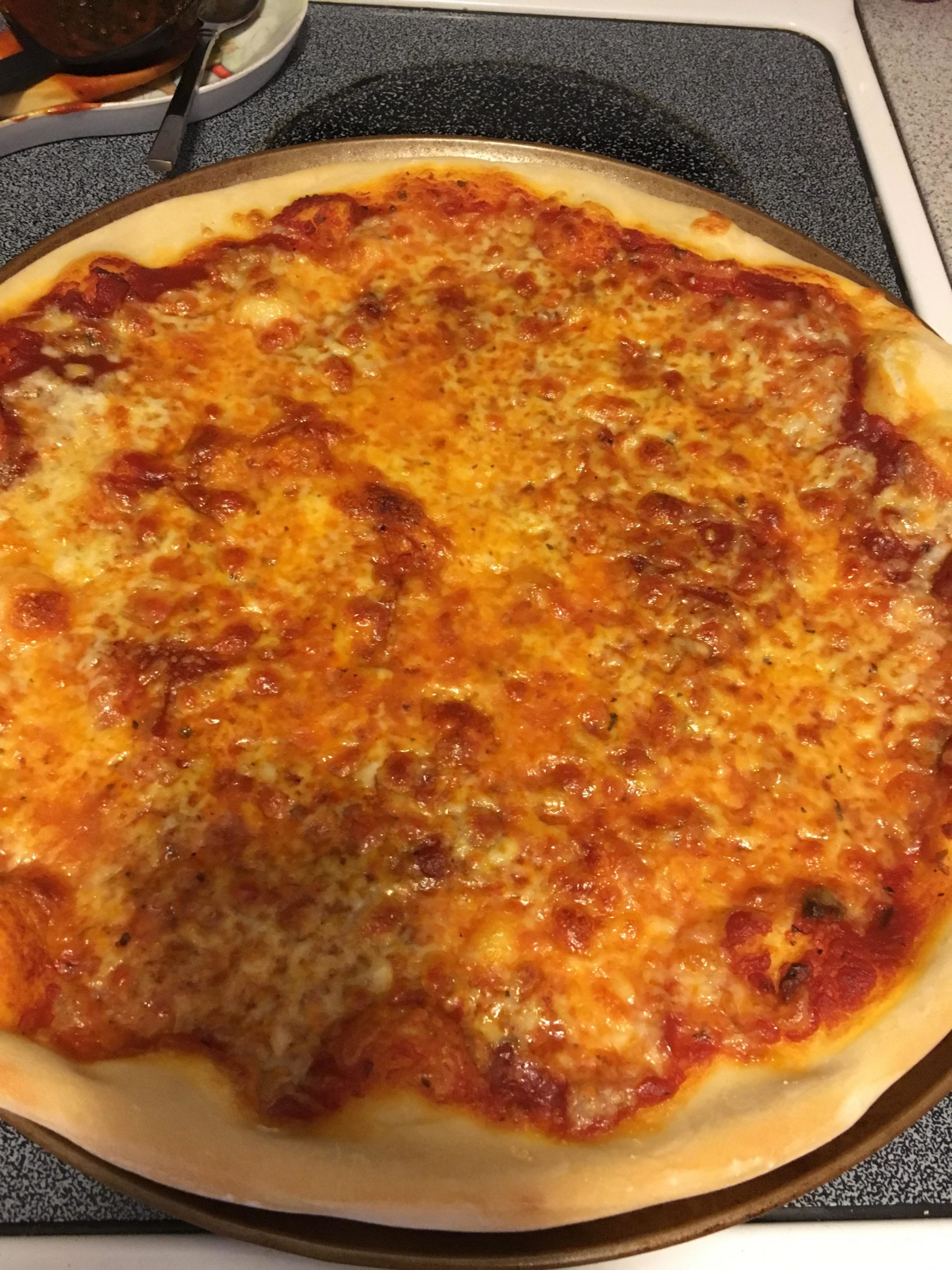 Just a simple Publix dough cooked on a perforated pizza pan. Dining