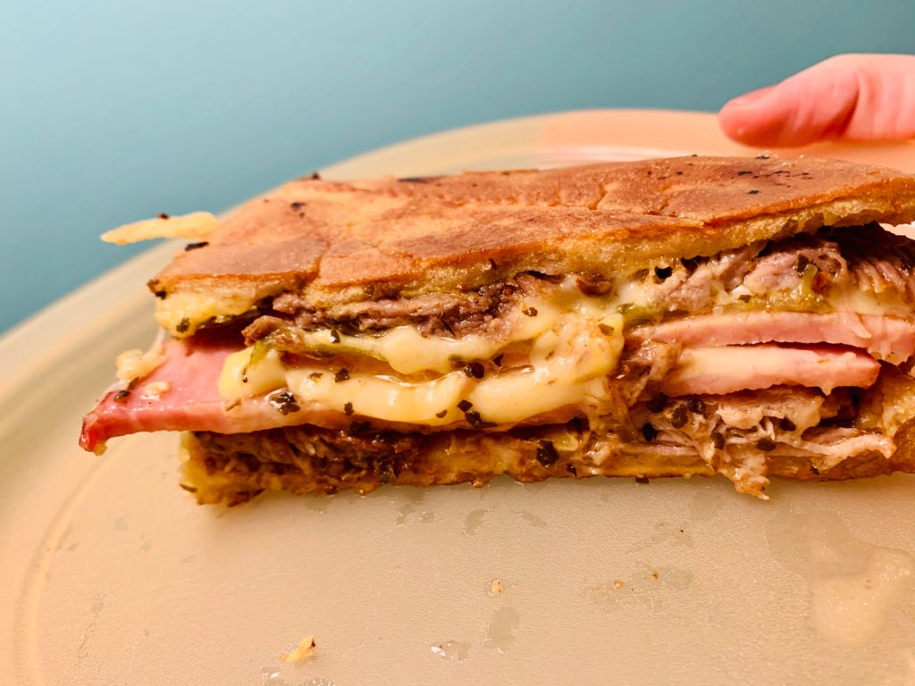 Homemade Cuban sandwich, dipped in roast pork pan sauce.