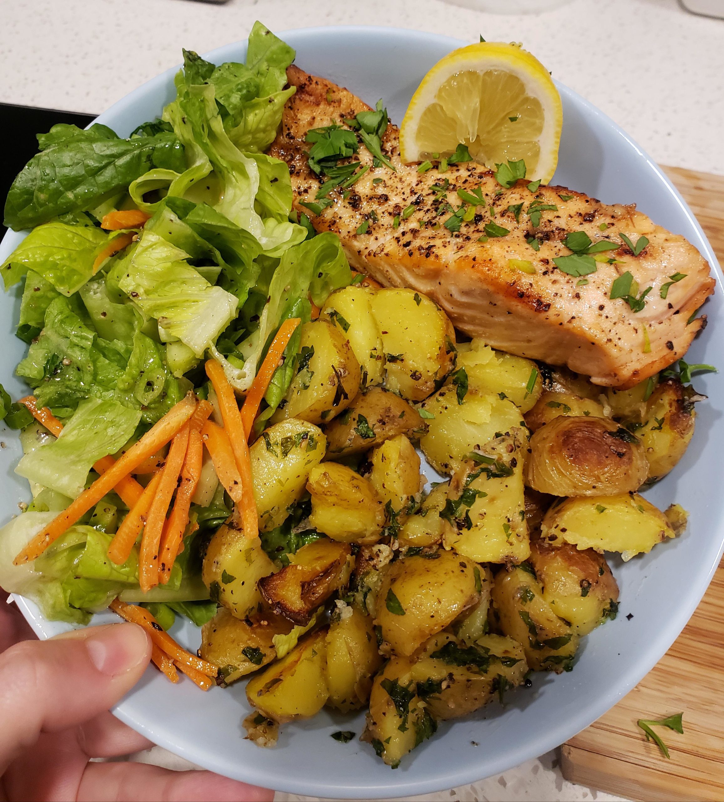 Grilled salmon, side salad with vinaigrette, and boiled-then-grilled ...