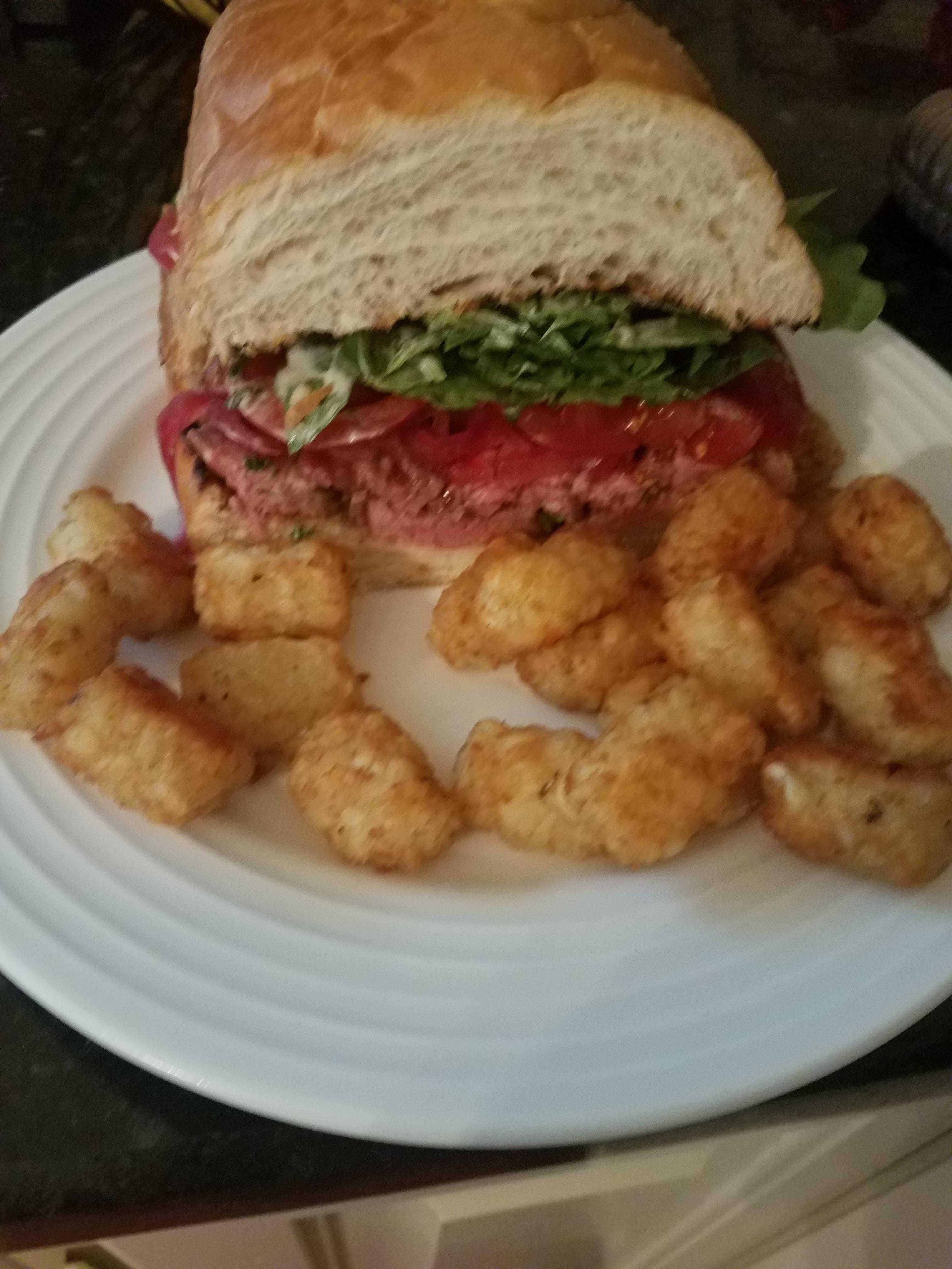 Steak sandwich garlic aioli, pickled red onions and arugula Dining