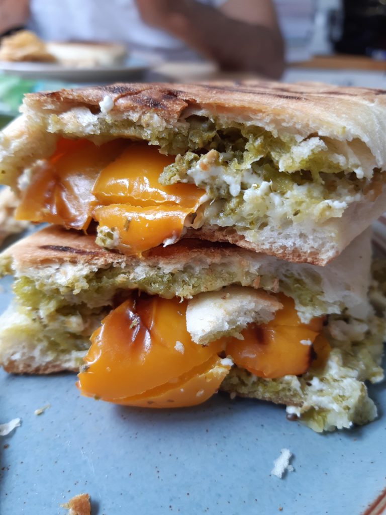 Feta, pesto, and grilled pepper panini