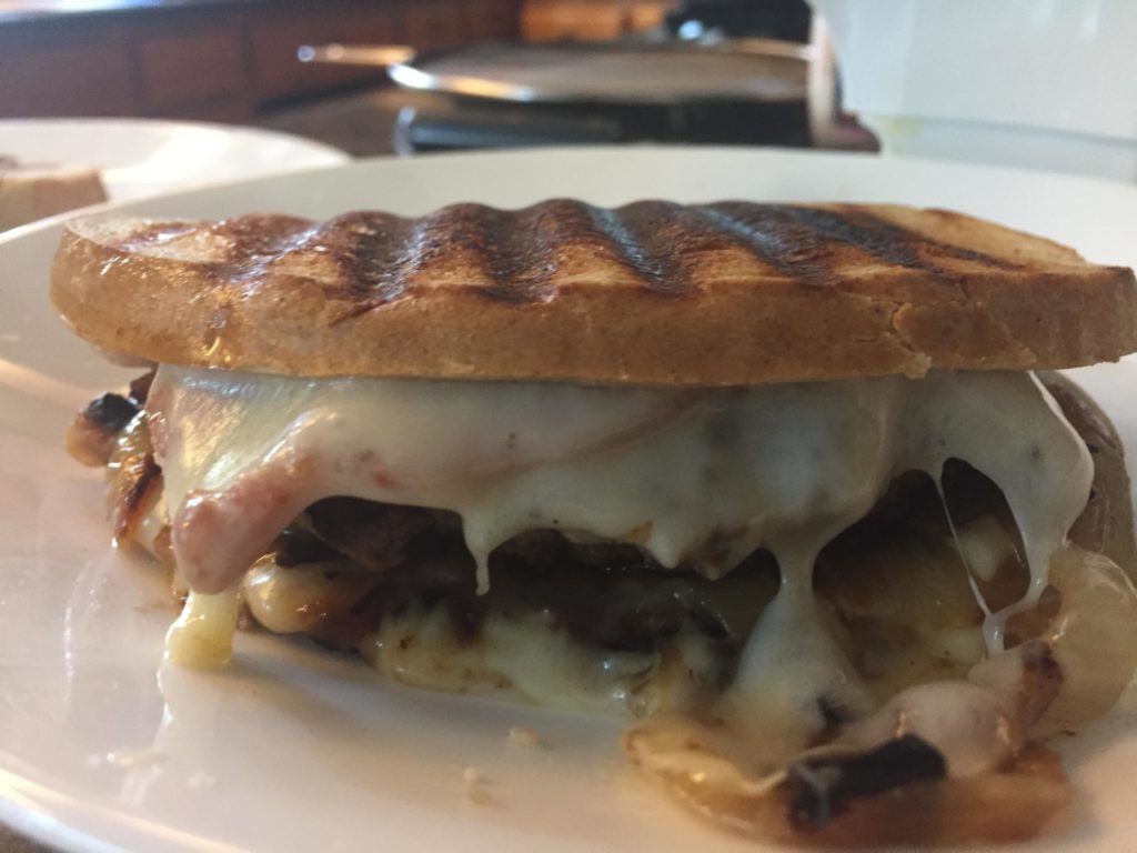 Patty Melt with Swiss, Onions, Bacon, Burger, and all on a light rye bun.