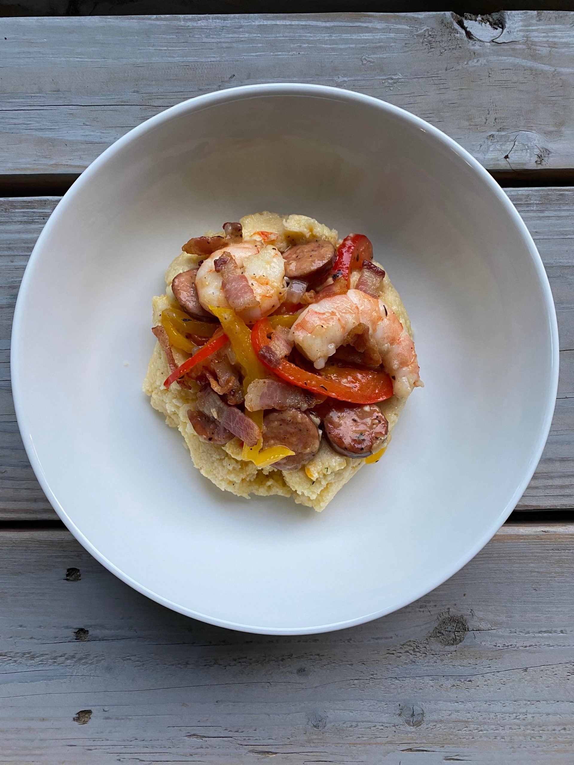 Shrimp and pimento cheese grits. A spicy sausage with bell peppers and