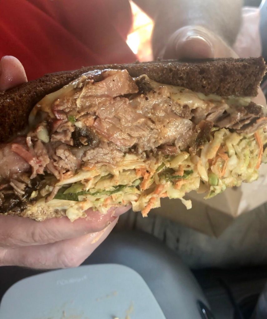 Smoked Brisket Reuben with coleslaw, pickled rye sauce, served on grilled honey wheat bread. BT’s Smokehouse, Sturbridge, MA.