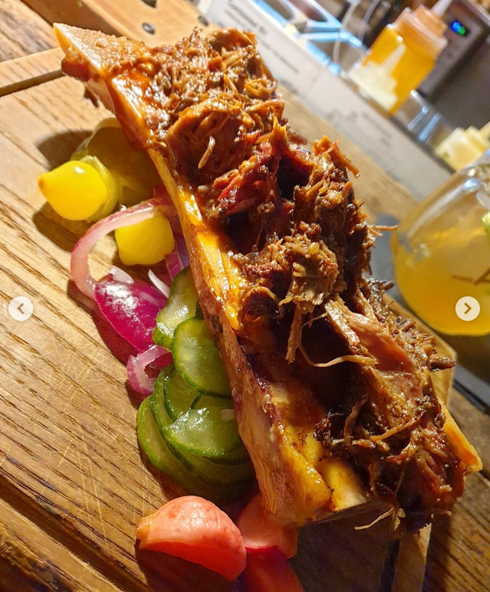 Jack Daniels pulled beef on top of oven roasted bone marrow served with