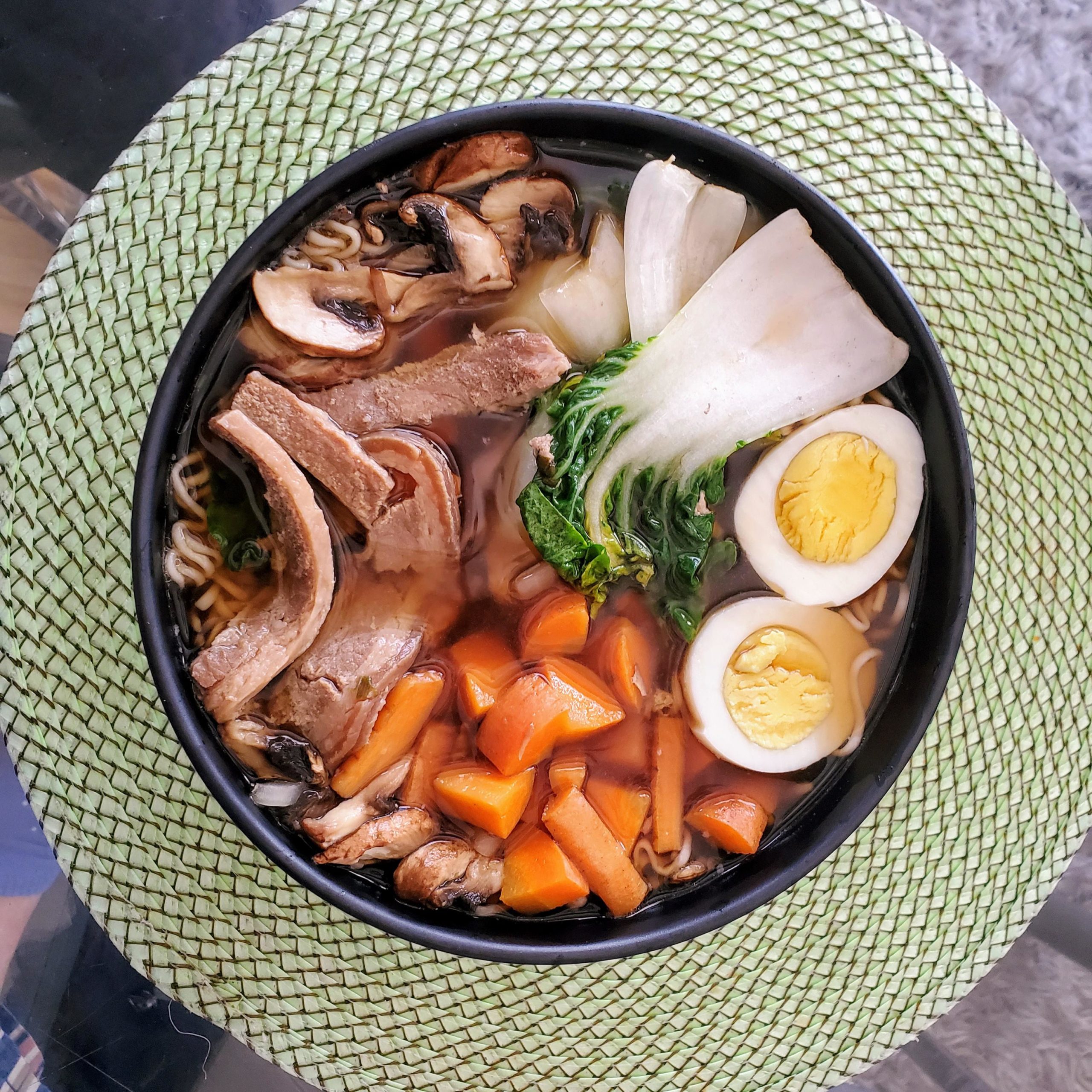 Homemade ramen broth by many vegetables, an egg, meat, and instant noodles! Dining