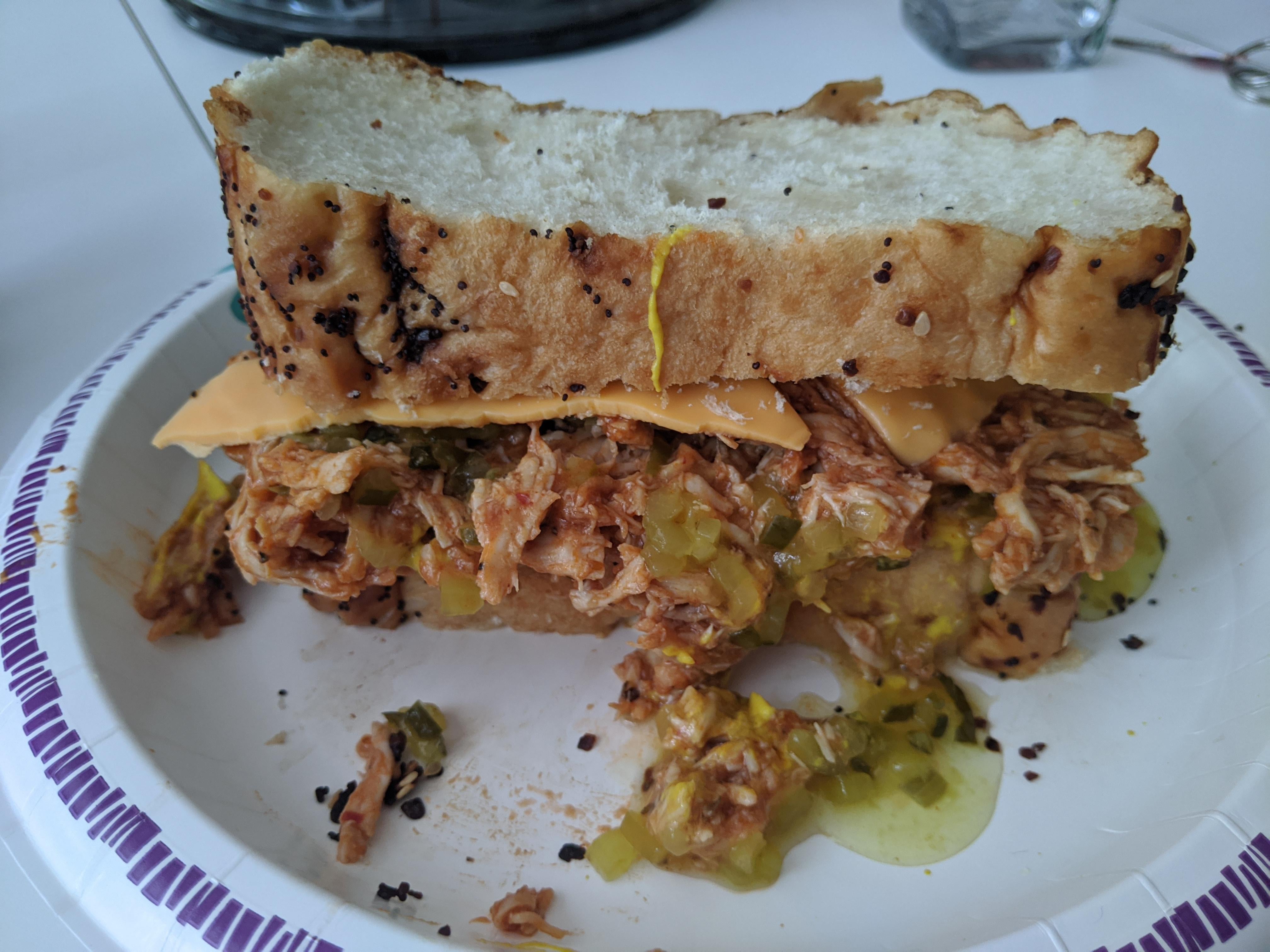 Pulled BBQ chicken, mustard, dill relish, and American cheese on