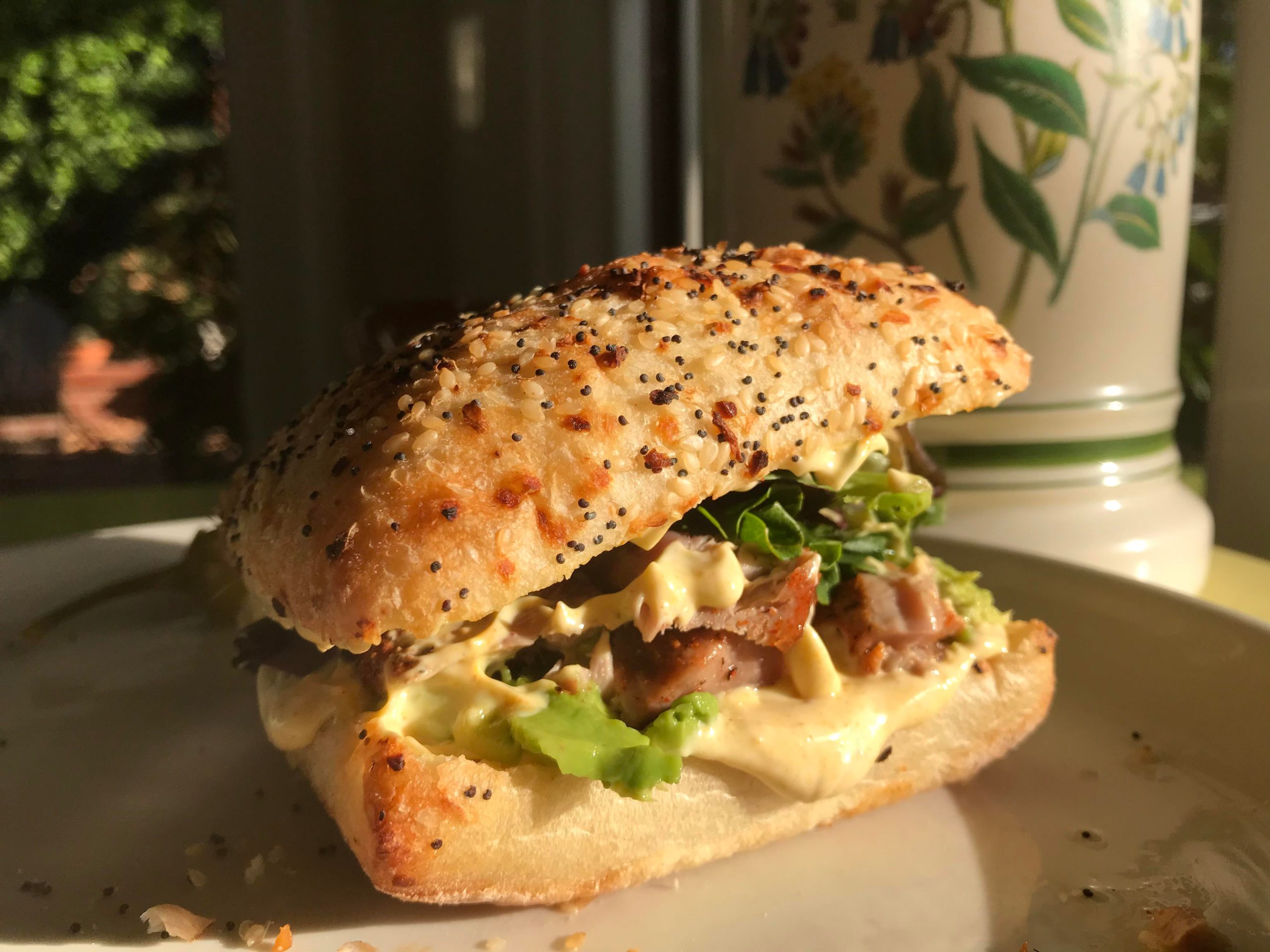 Seared ahi tuna, curry mayo, avocado, lettuce, and onion on an everything ciabatta Dining and