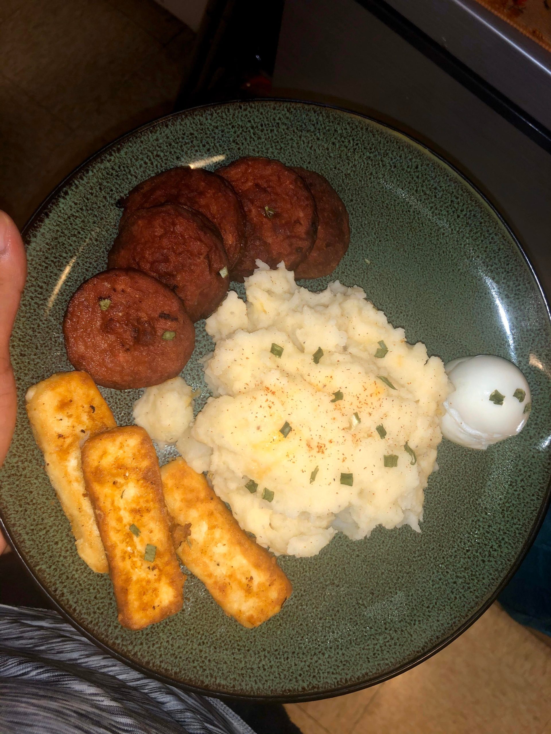 Fried salami, fried queso frito cheese, boiled egg, mashed potatoes