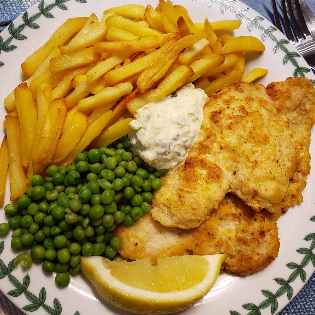 Sole fillets pan fried in butter, serve with fries, peas, and homemade tartar sauce