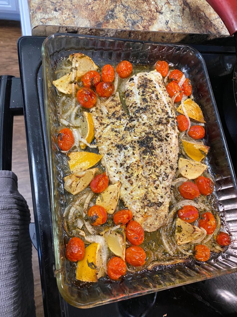 Roasted red snapper with tomatoes and onions