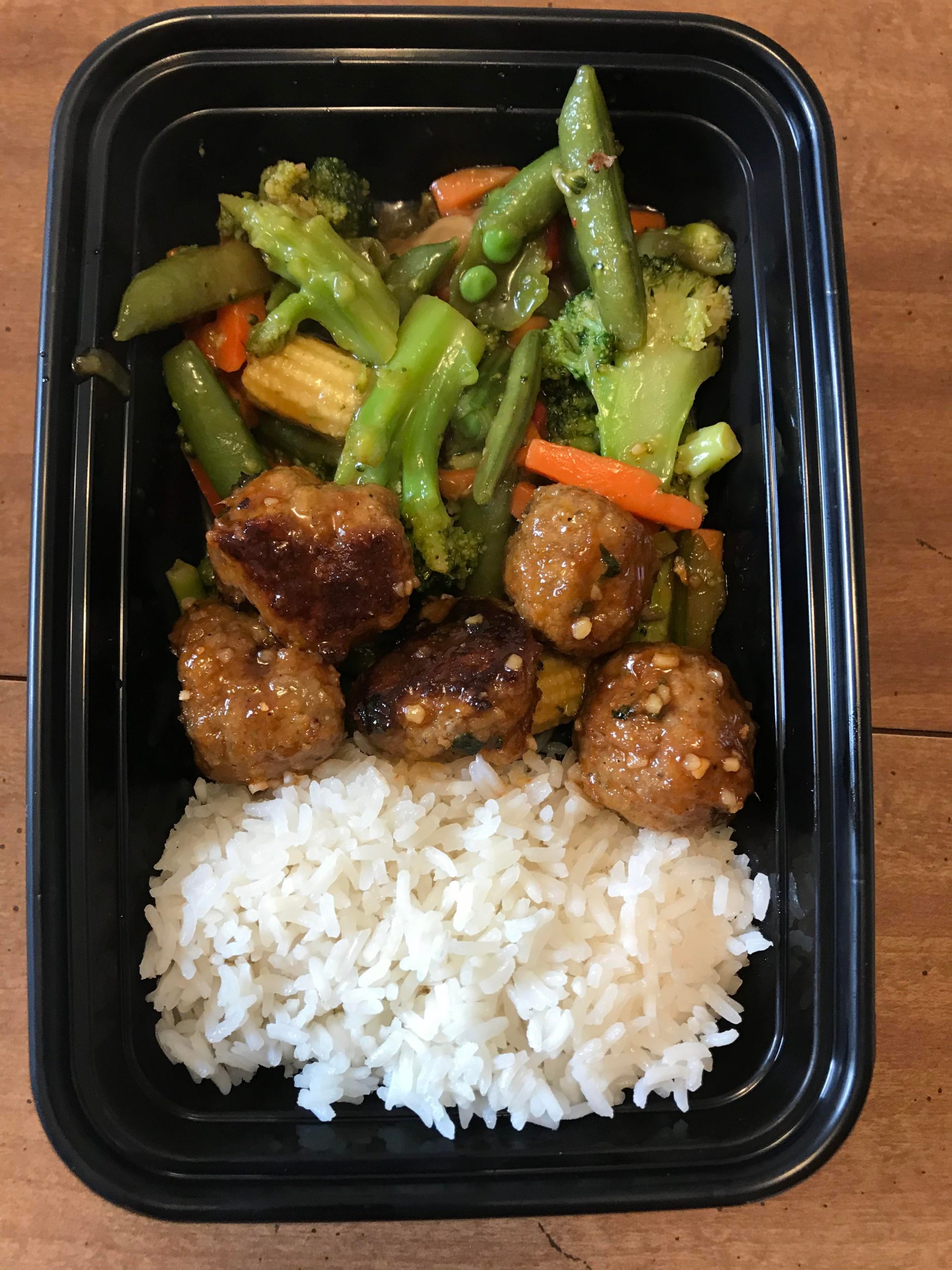 Honey Sriracha glazed meatballs with rice and stir fried veggies! Sweet