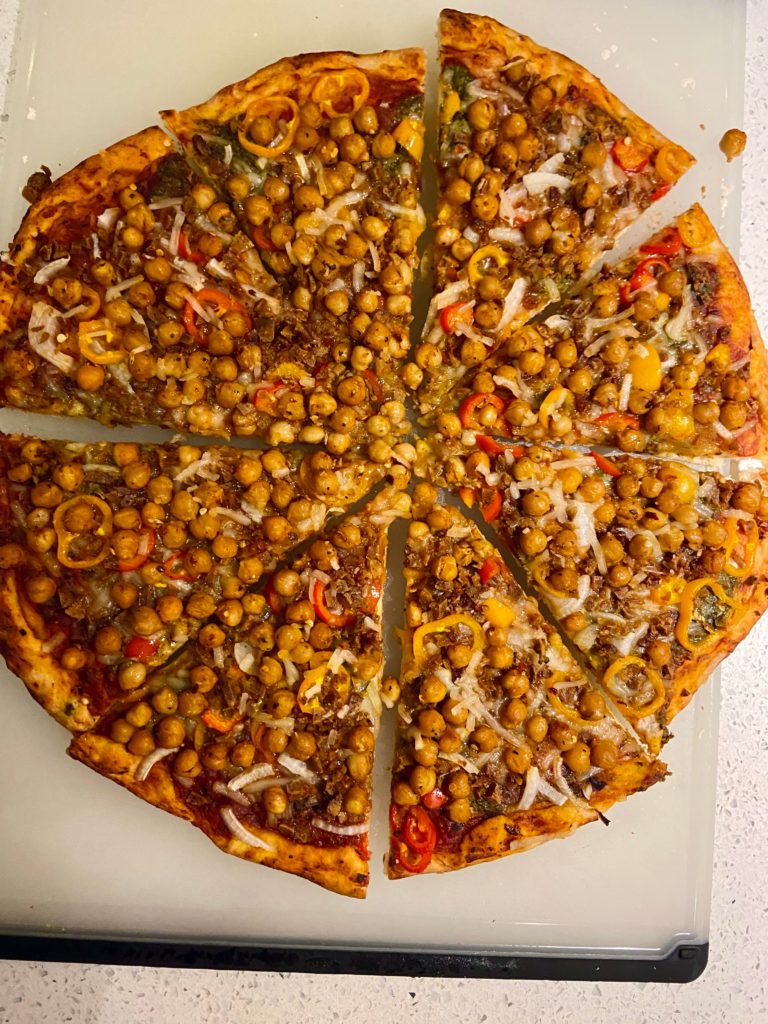 Homemade vegan supreme pizza featuring chickpea pepperoni. 🤯