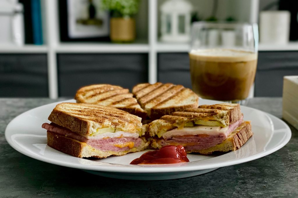 Grilled Ham, Chicken & Turkey with Cheddar, Spicy Mayo, Mustard & Pickles on Rye