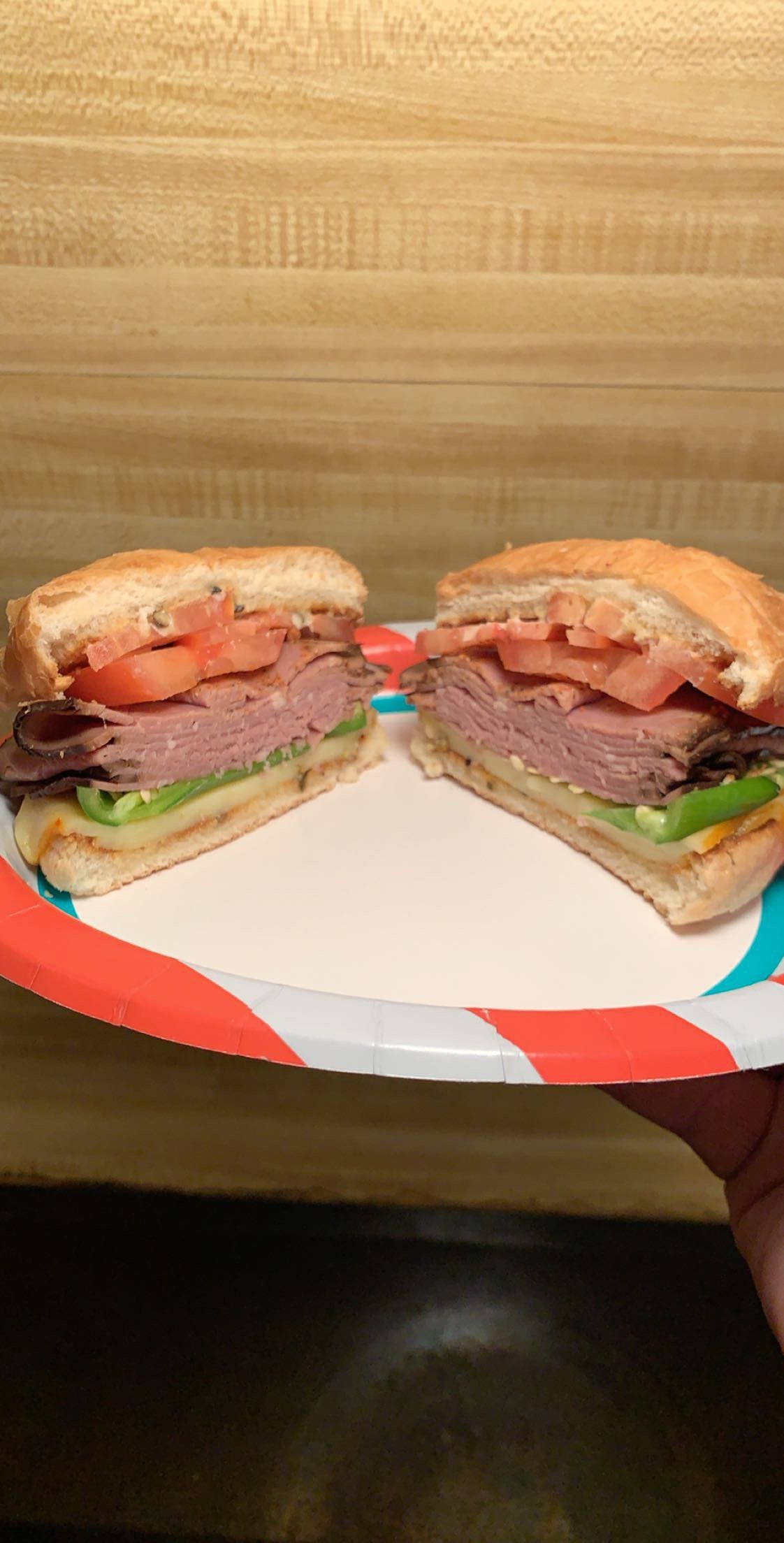 Fresh hamburger bun, red pepper hummus, Muenster cheese, fresh Serrano